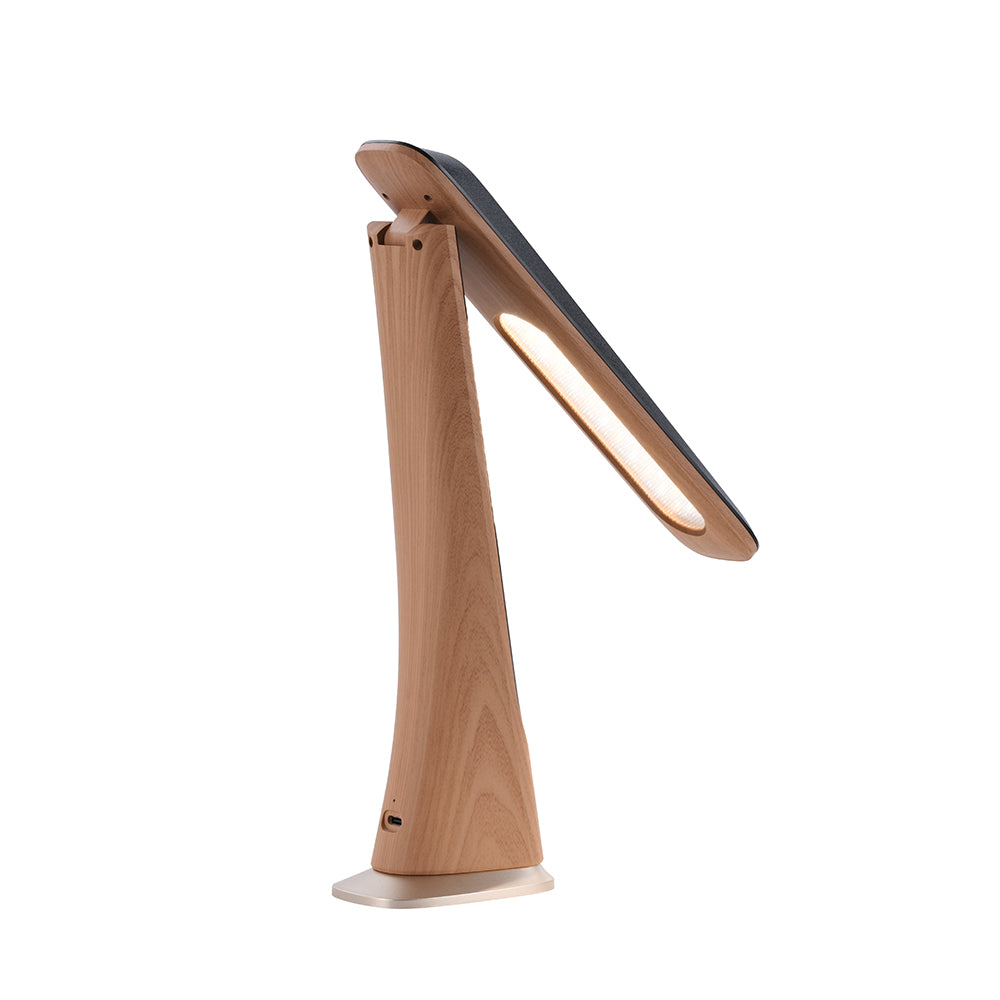Moderne Schreibtischlampe aus Holz mit schwarzer Oberseite und leuchtendem LED-Panel auf weißem Hintergrund.