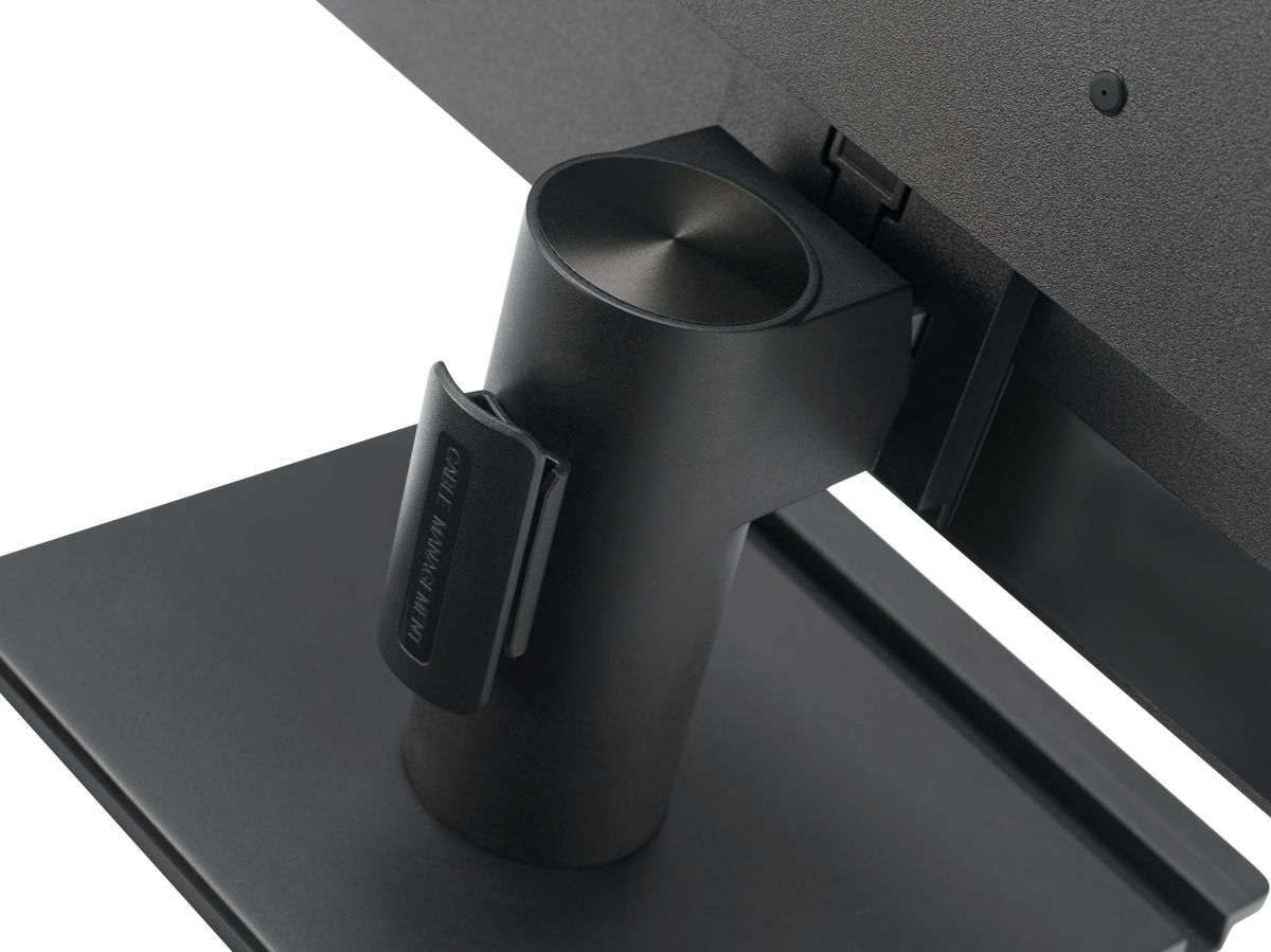 Black monitor stand with a cable management clip on the back against a white background.