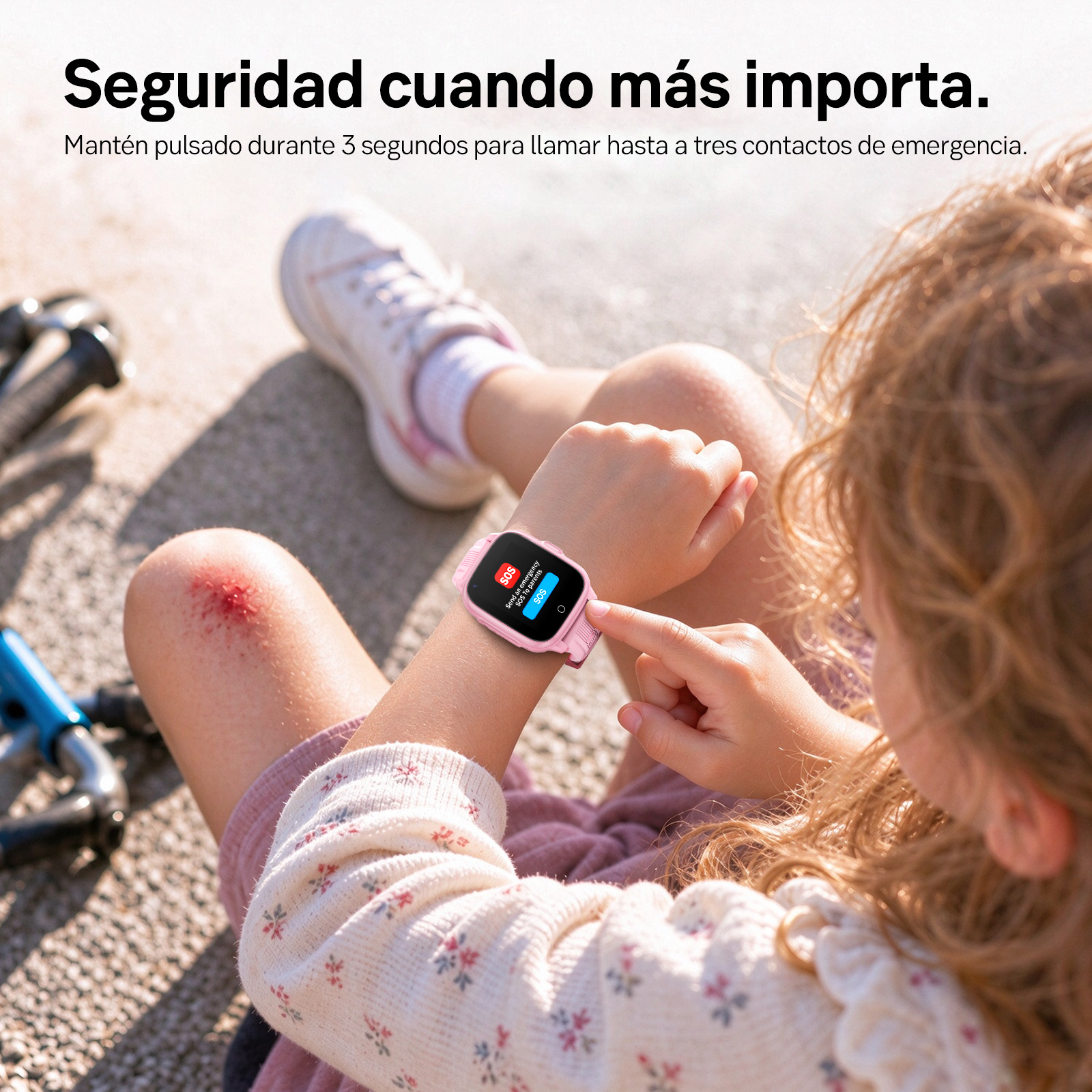 Un niño con la rodilla raspada presiona el botón SOS de un reloj inteligente rosa.