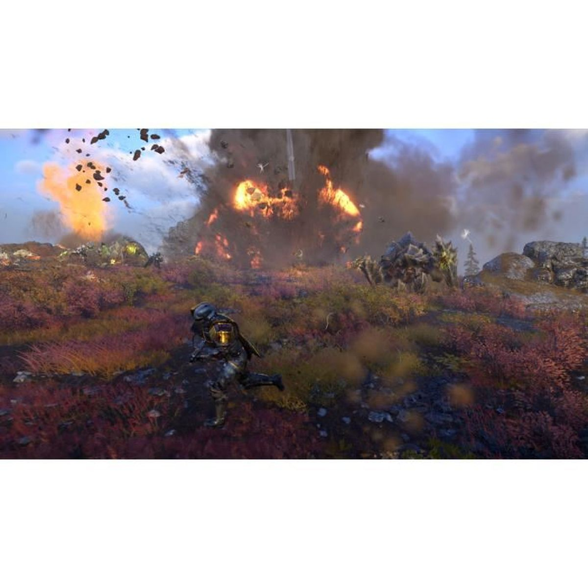 Un soldat court à travers un champ rocheux rouge, fuyant une explosion massive en arrière-plan.