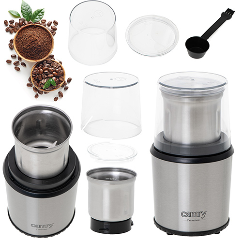 Edelstahl-Kaffeemühle mit Zubehör, Kaffeebohnen und gemahlenem Kaffee auf weißem Hintergrund.