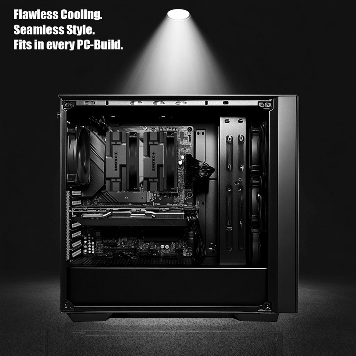 Schwarzes PC-Gehäuseinnere mit Mainboard, zwei CPU-Kühlern und Grafikkarte im Scheinwerferlicht.