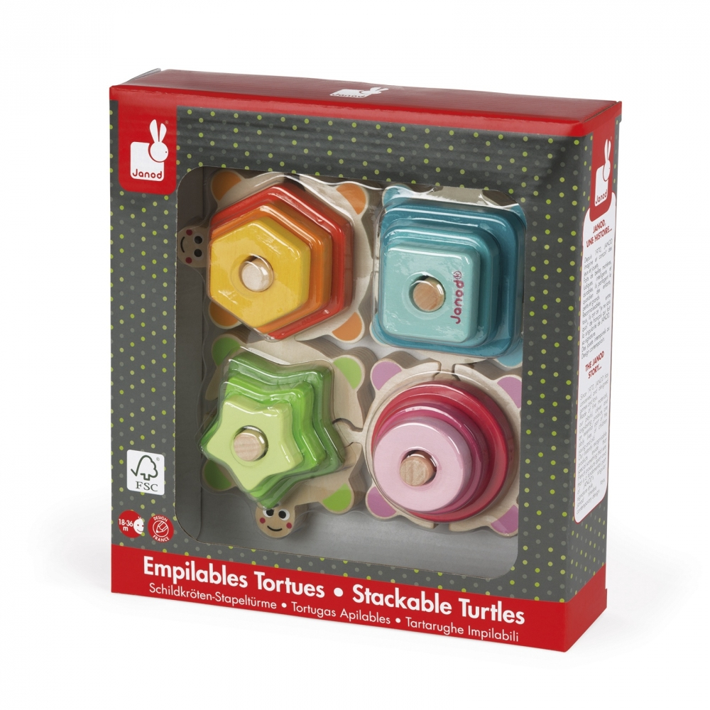 Gioco di tartarughe impilabili Janod, con forme in legno colorate in una scatola.