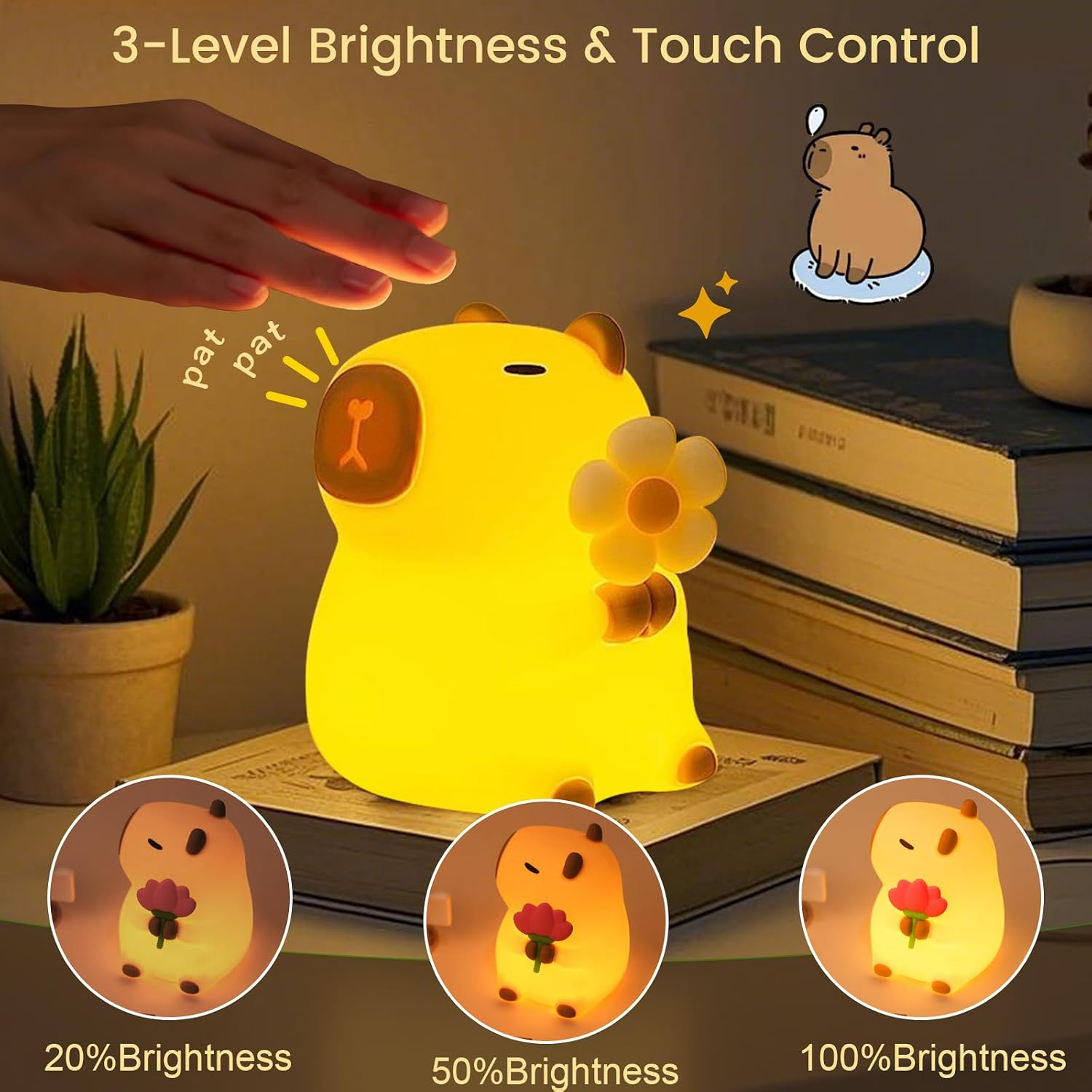 Eine Hand berührt eine niedliche, gelb leuchtende Capybara-Lampe, die eine Blume hält.