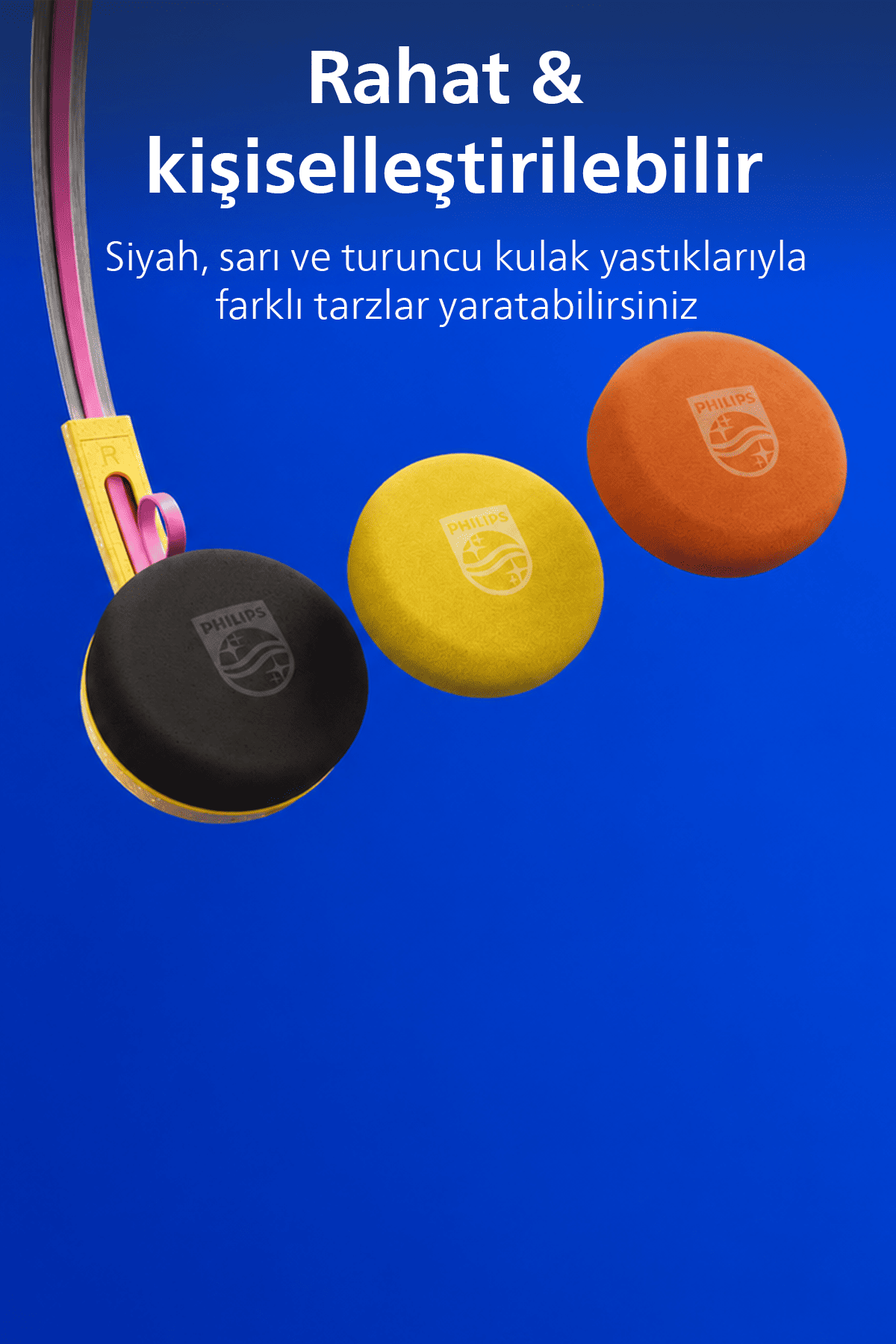 Philips Kopfhörer mit austauschbaren schwarzen, gelben und orangen Ohrpolstern vor blauem Hintergrund.