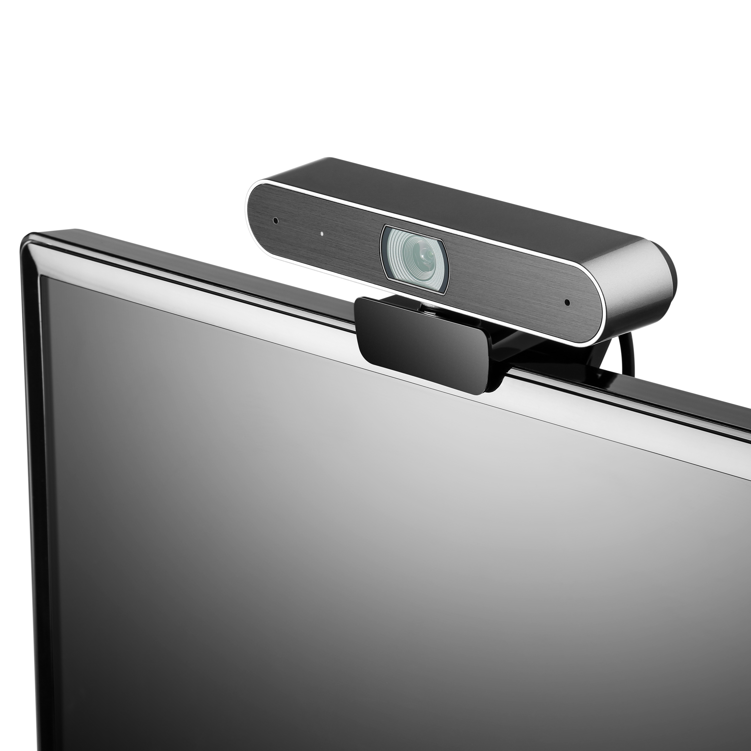 Webcam oben auf einem Monitor. Sie ist silberfarben mit schwarzem Clip und zentriertem Objektiv.