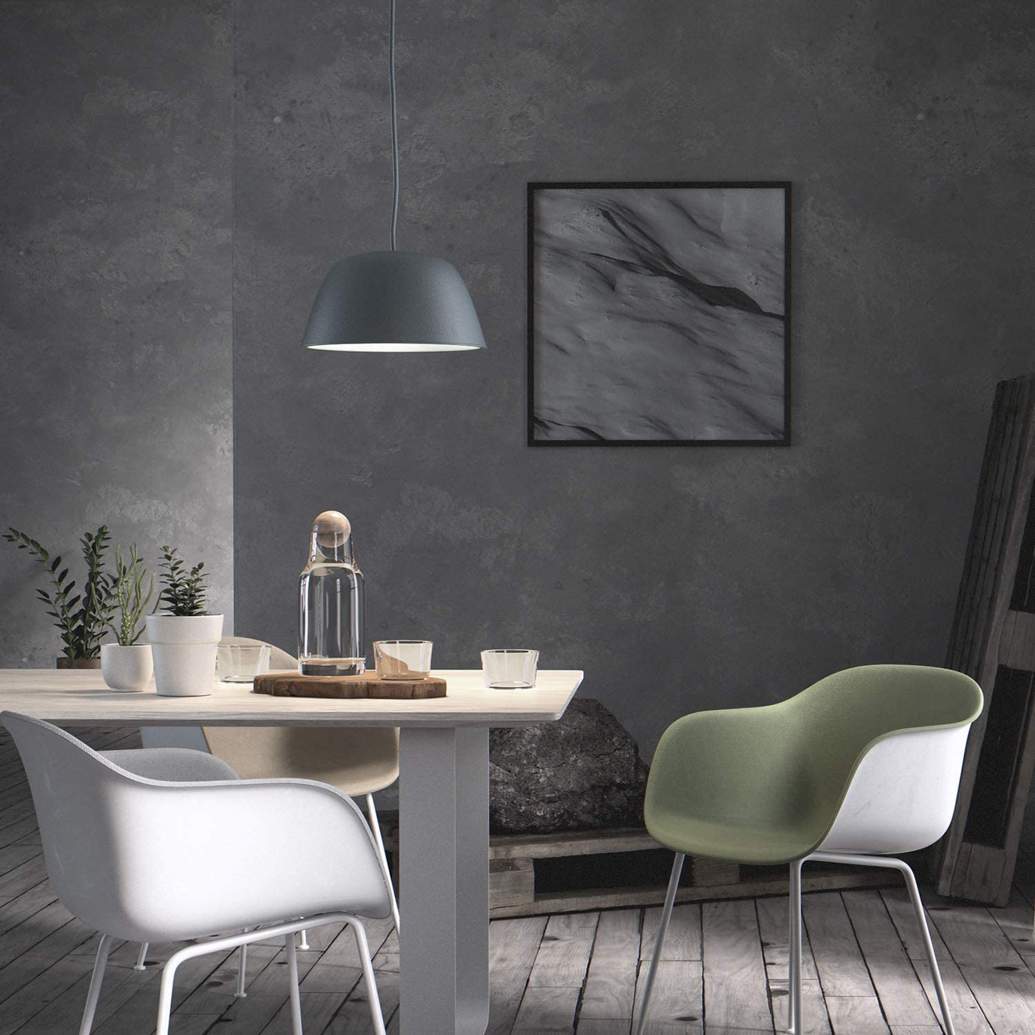 Un tavolo da pranzo con sedie, piante e un quadro alla parete.