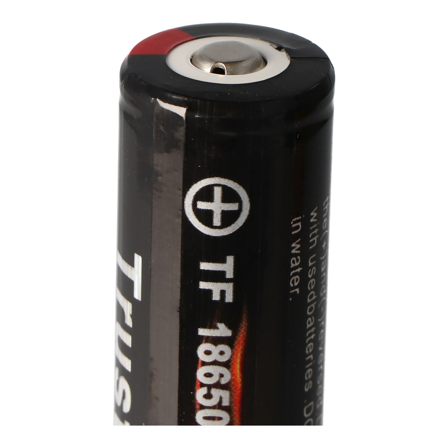 Black TrustFire TF 18650 battery. Shows positive end with a silver top and label.