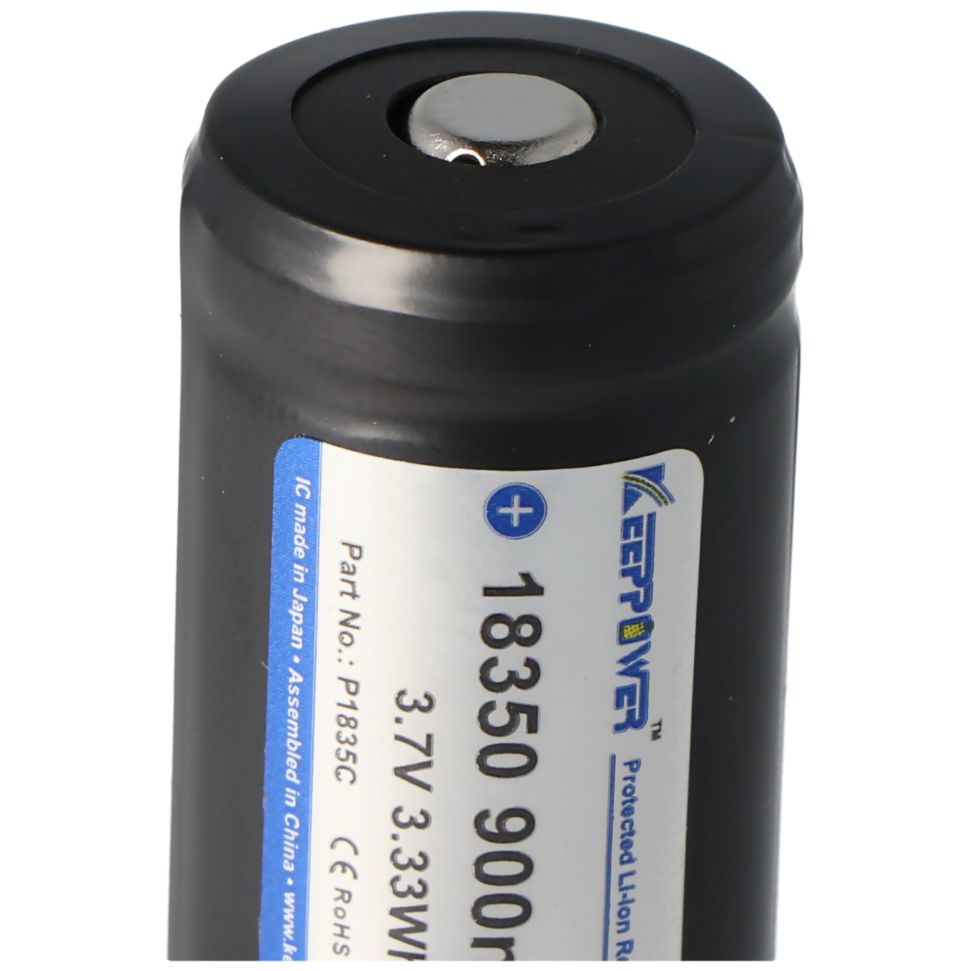Close-up of a black 18350 battery with a white label and a metal top.