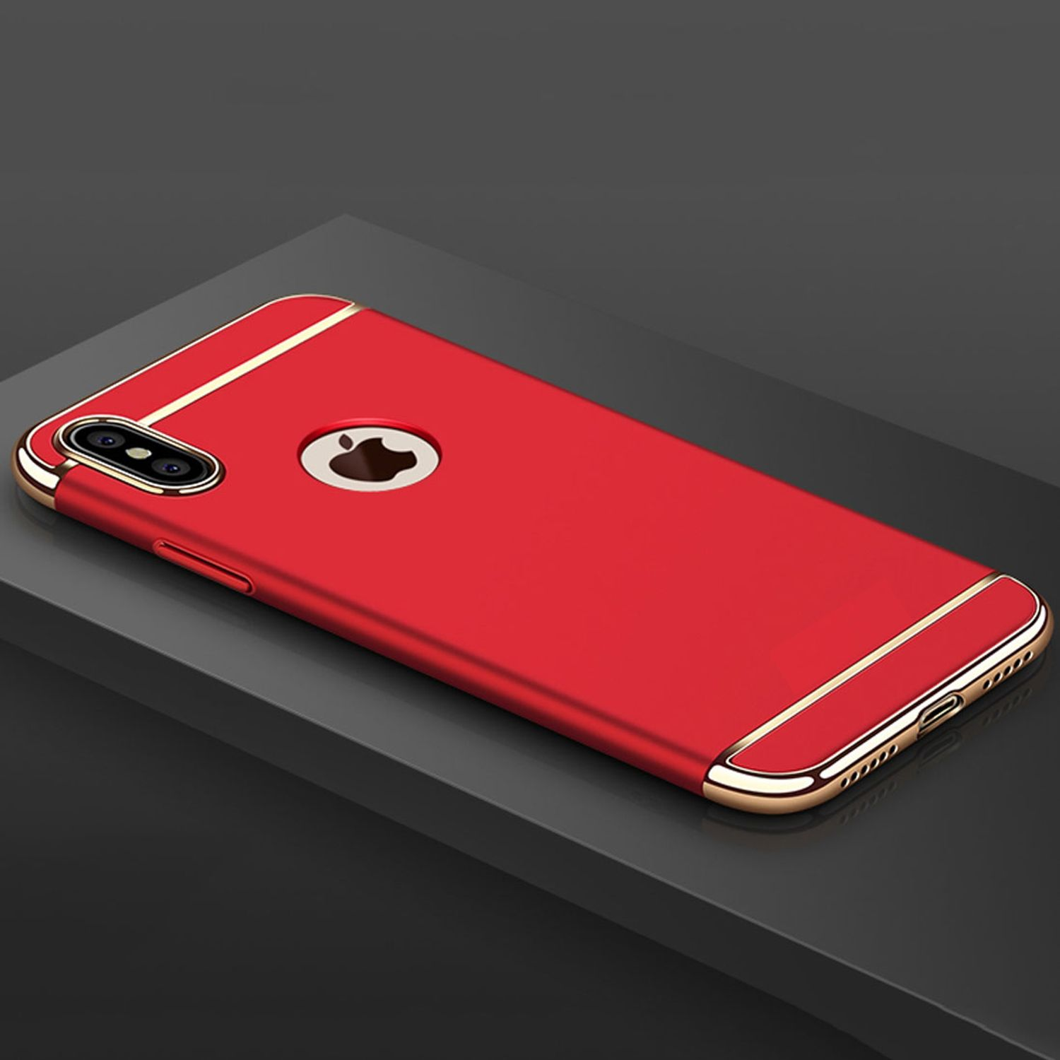 Rote iPhone-Hülle mit goldener Zierleiste, Apple-Logo. Dunkelgraue Oberfläche.