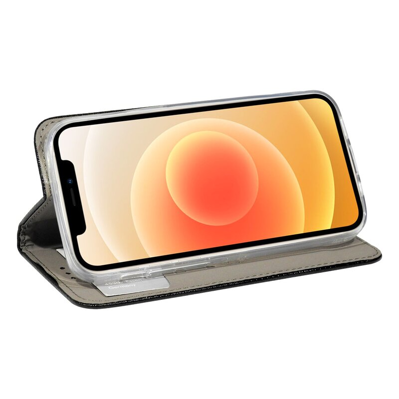 Telefon im geöffneten Gehäuse. Das Telefon zeigt einen orangefarbenen Hintergrund. Das Gehäuse ist schwarz.