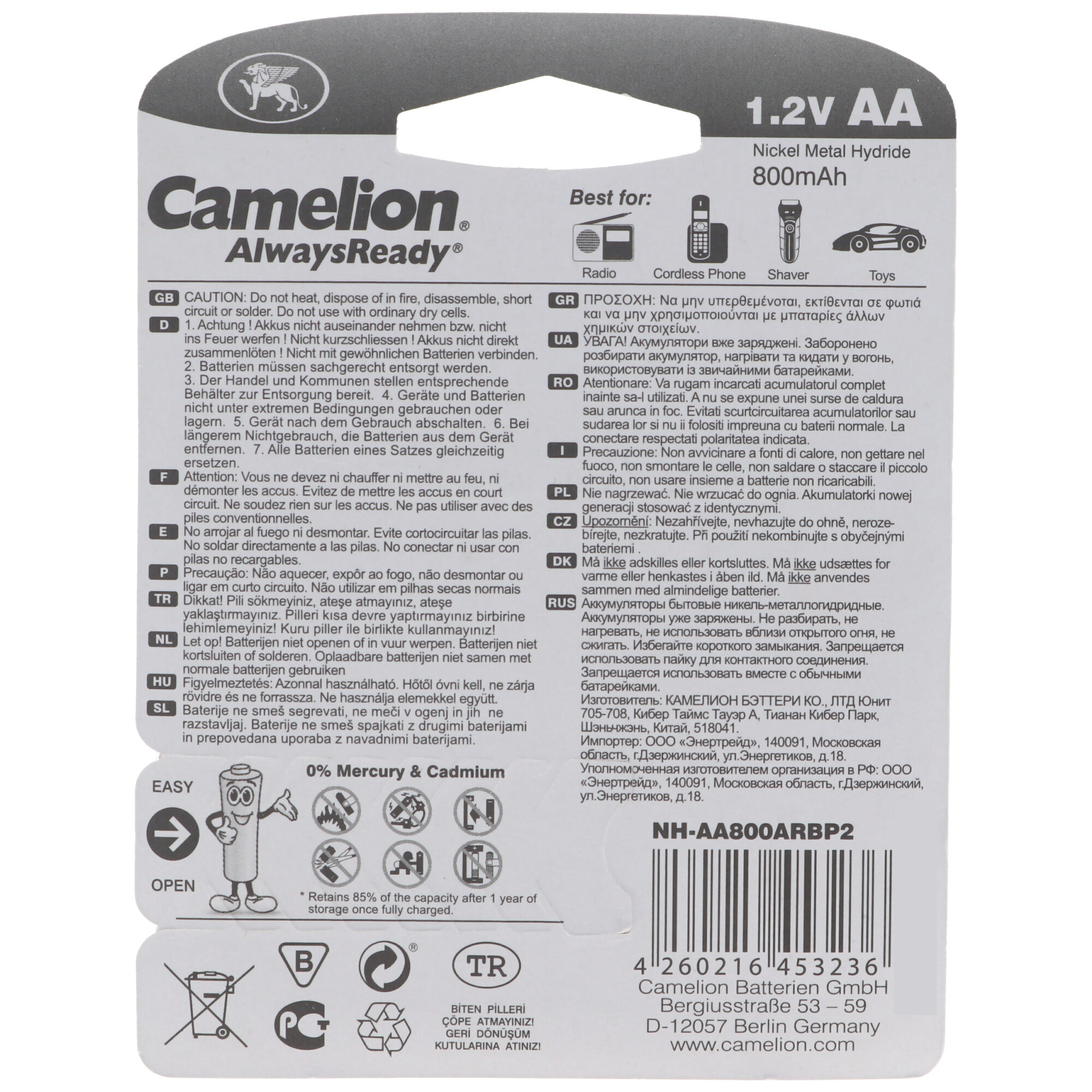 Battery pack with warnings in multiple languages. The battery is black with a label.
