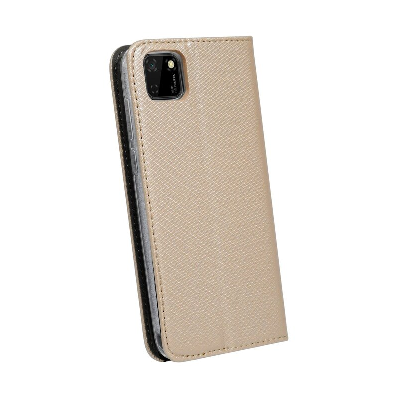 Eine goldene Handyhülle mit einem Telefon darin. Es ist eine geschlossene Hülle mit Diamantenmuster.