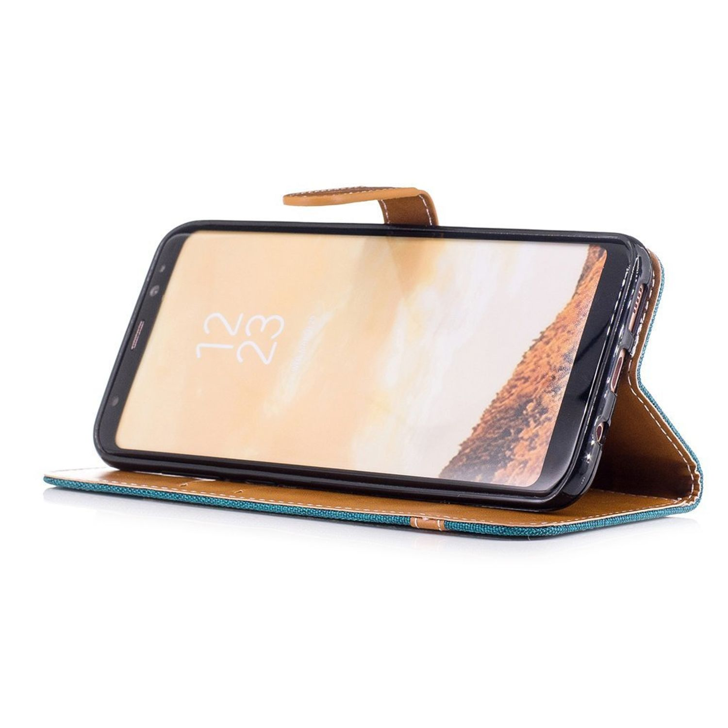 Telefon in Ledertasche. Telefon auf braun-blauem Etui, mit offenem Deckel.