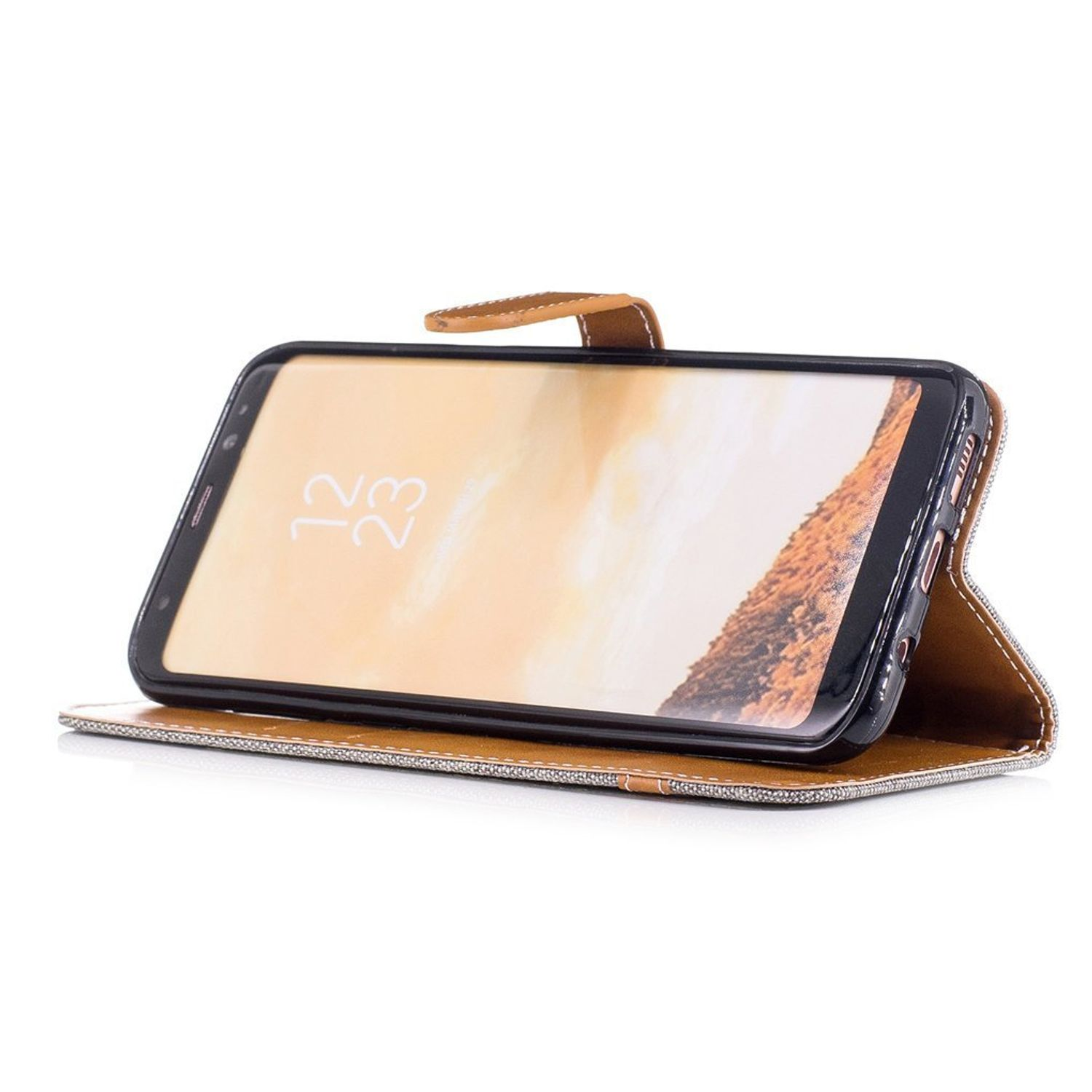 Geöffnete Handyhülle mit Telefon im Inneren. Der Hintergrund ist braun und weiß. Das Telefon ist sichtbar.