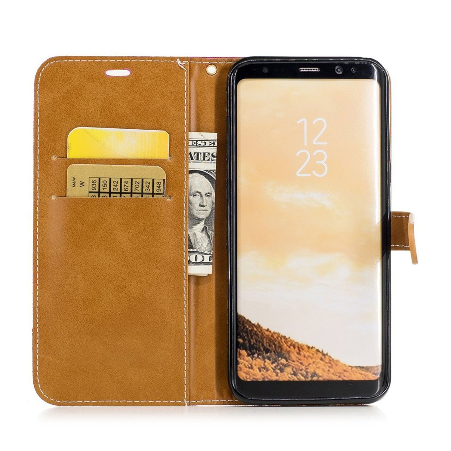 Ein Telefon in einer braunen Brieftaschenhülle. Im Inneren befinden sich Kreditkarten und Geld.