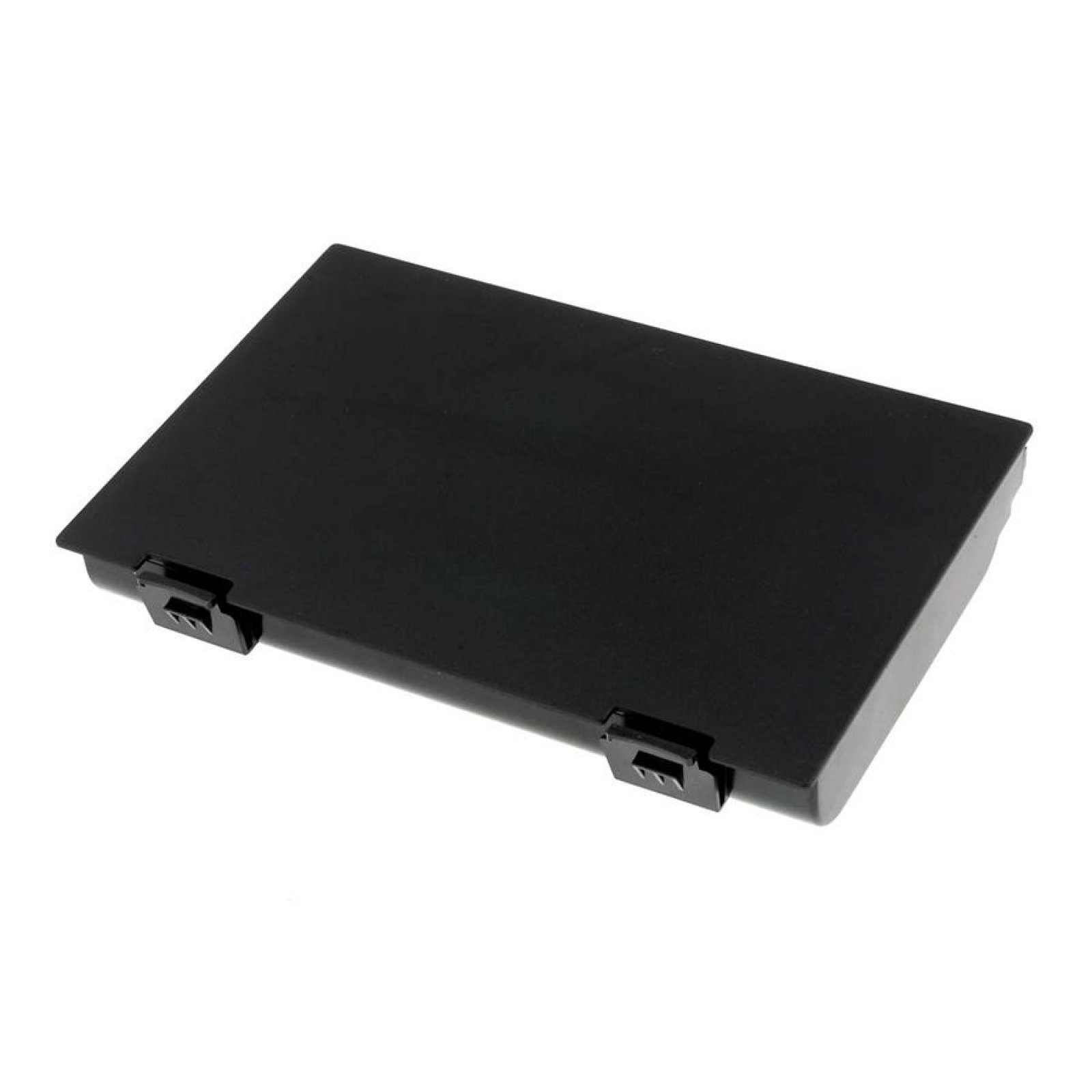 Una caja rectangular negra con clips en los lados, probablemente una carcasa de batería de portátil, sobre una superficie blanca.