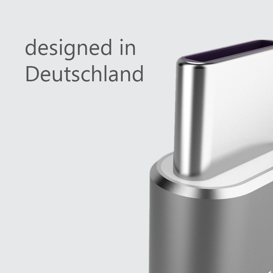 Silberner USB-C-Anschluss mit dem Text 'designed in Deutschland'.