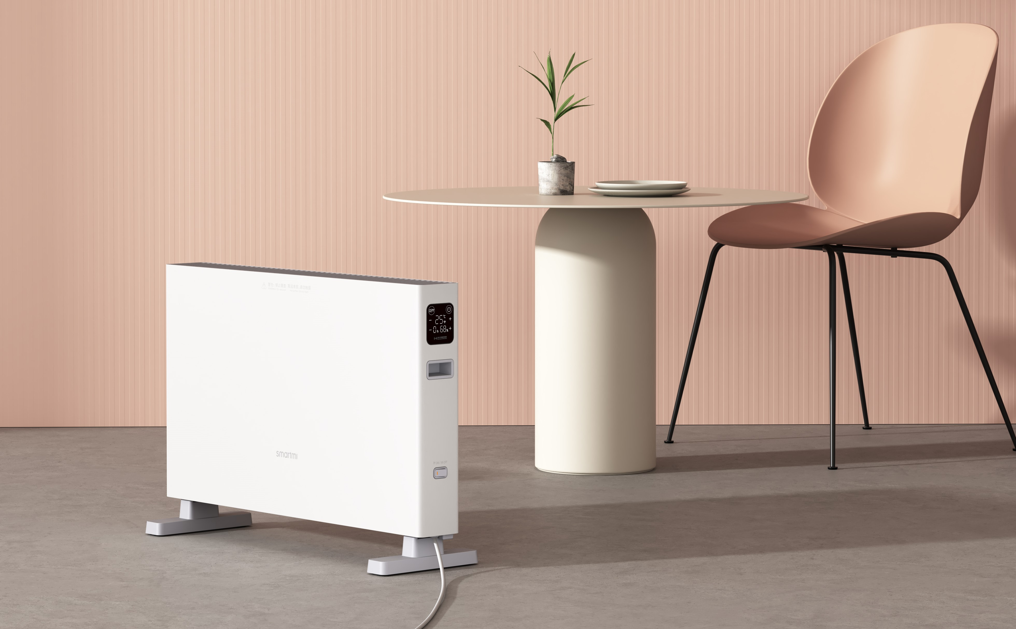 Biały grzejnik elektryczny w pokoju ze stołem i krzesłem.