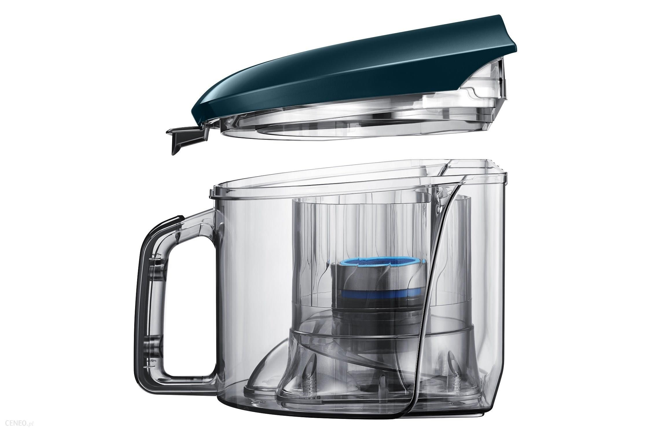 Contenitore della polvere dell'aspirapolvere. Il coperchio superiore è aperto. Sfondo bianco.