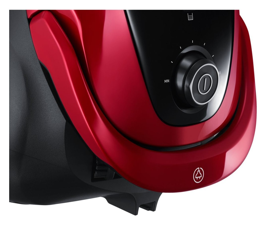 Zbliżenie panelu sterowania czerwonego odkurzacza z przyciskiem i pokrętłem.