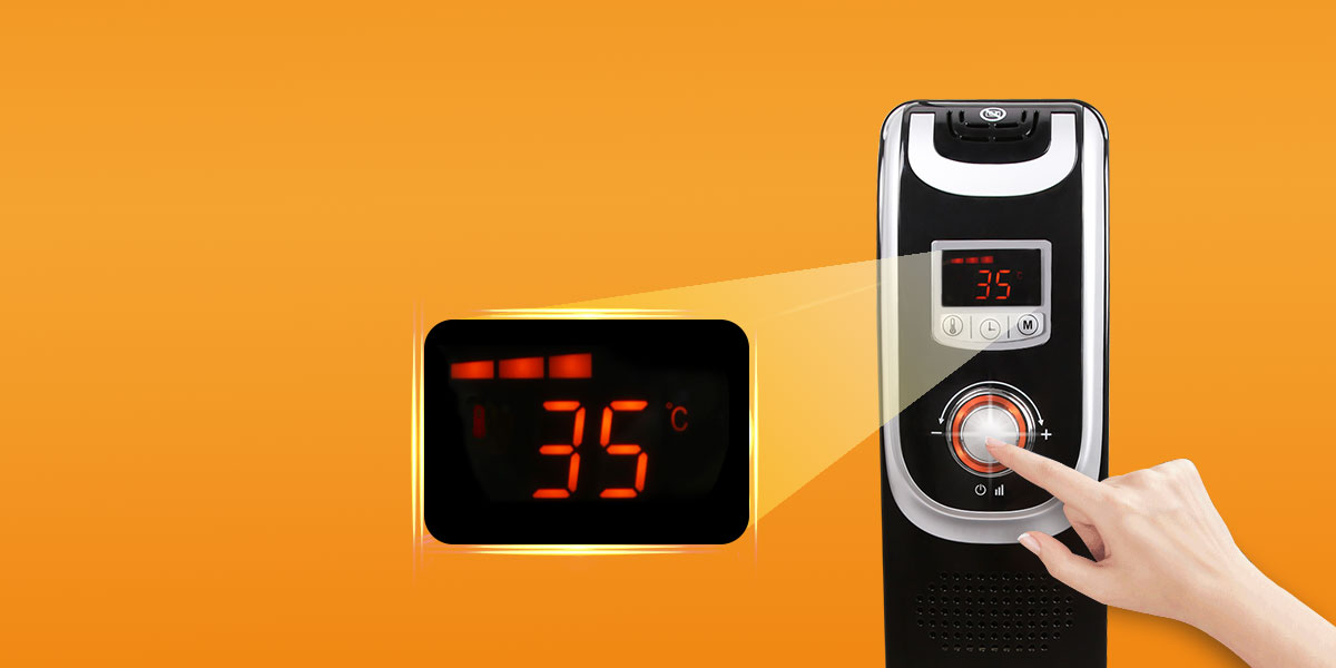 Un termoconvettore nero con display digitale che mostra 35°C. Una mano tocca la manopola della temperatura.