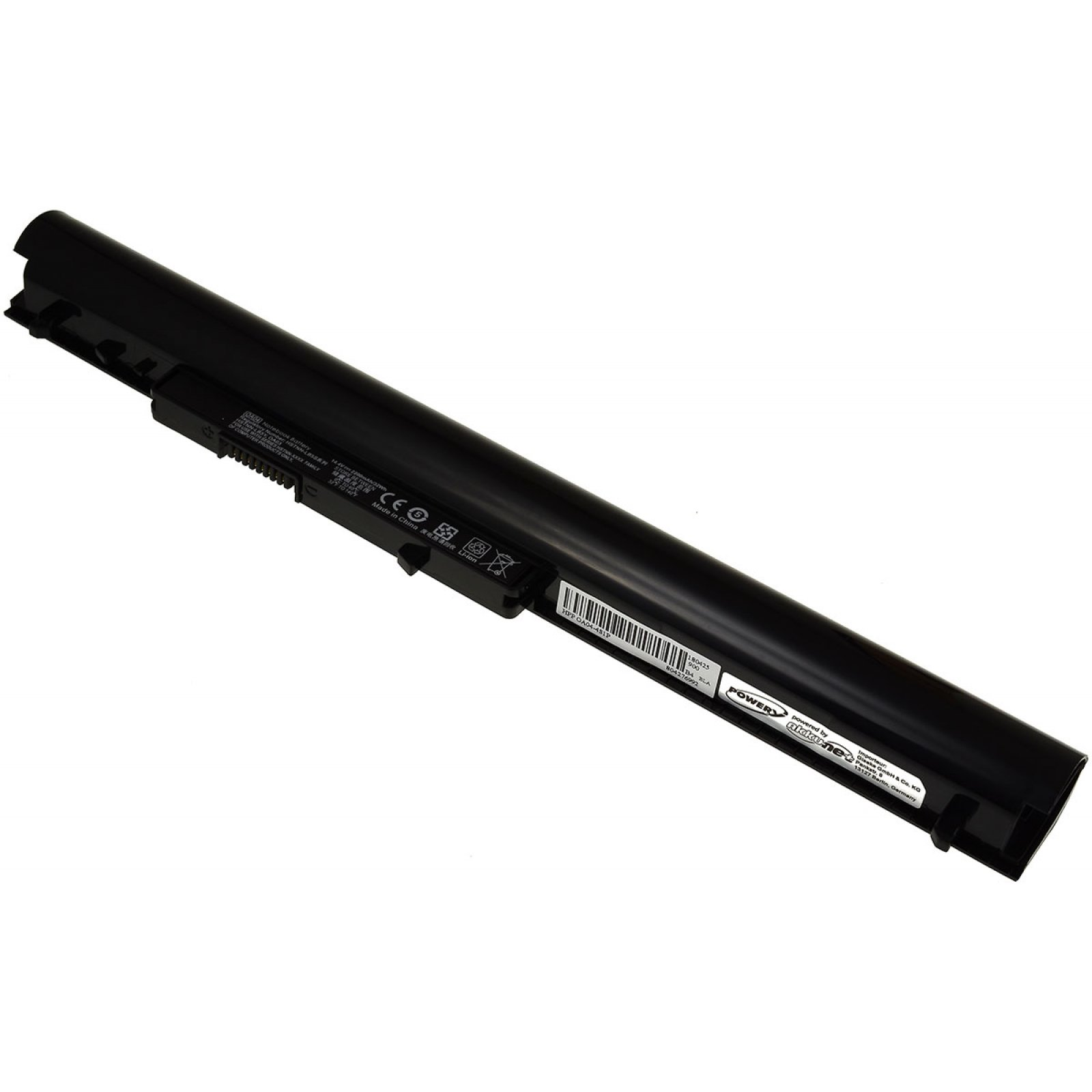 Batería de laptop negra. La batería es rectangular y tiene algunas etiquetas. Fondo blanco.
