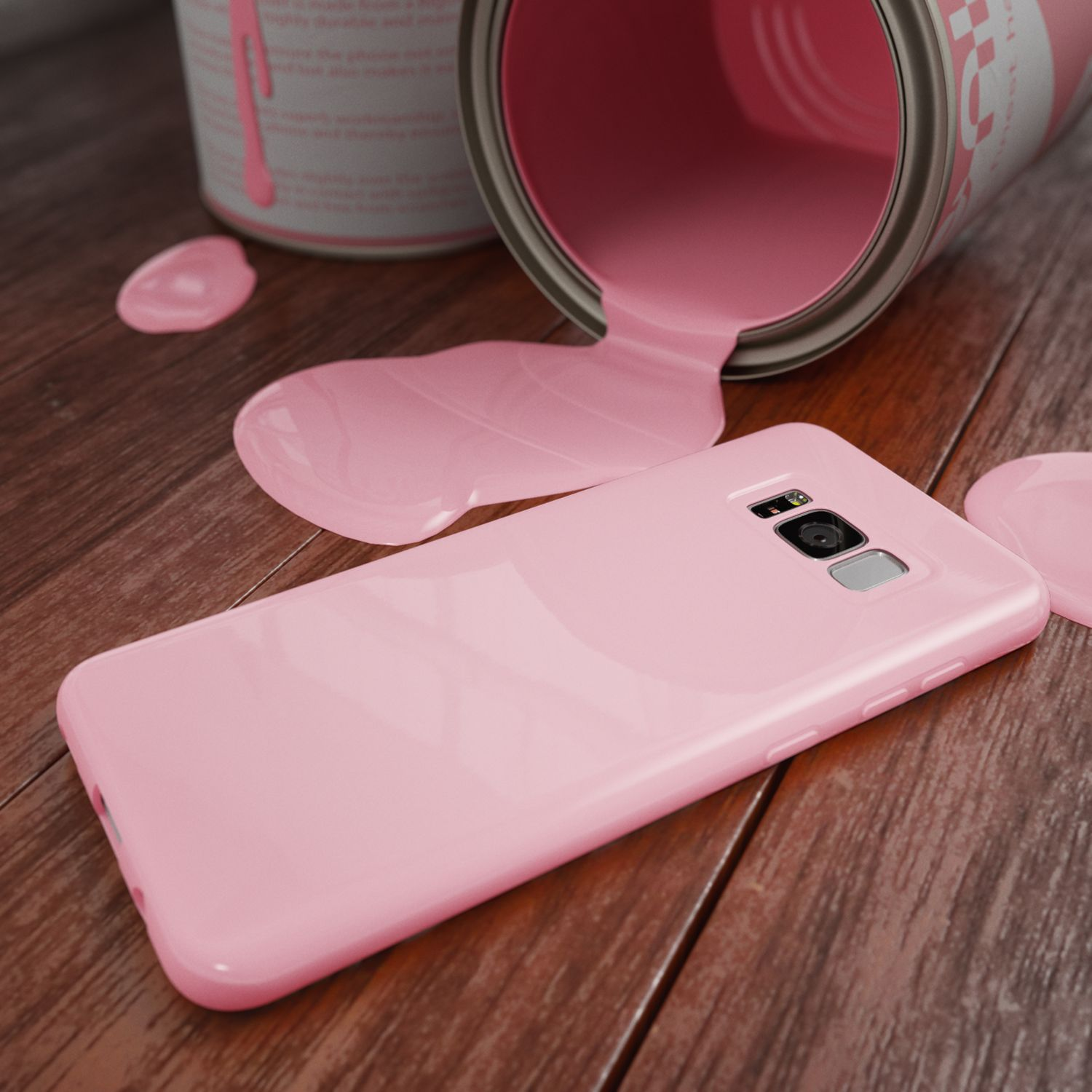 Ein Telefon in einer rosa Hülle auf Holzoberfläche mit verschütteter rosa Farbe und Farbeimer.