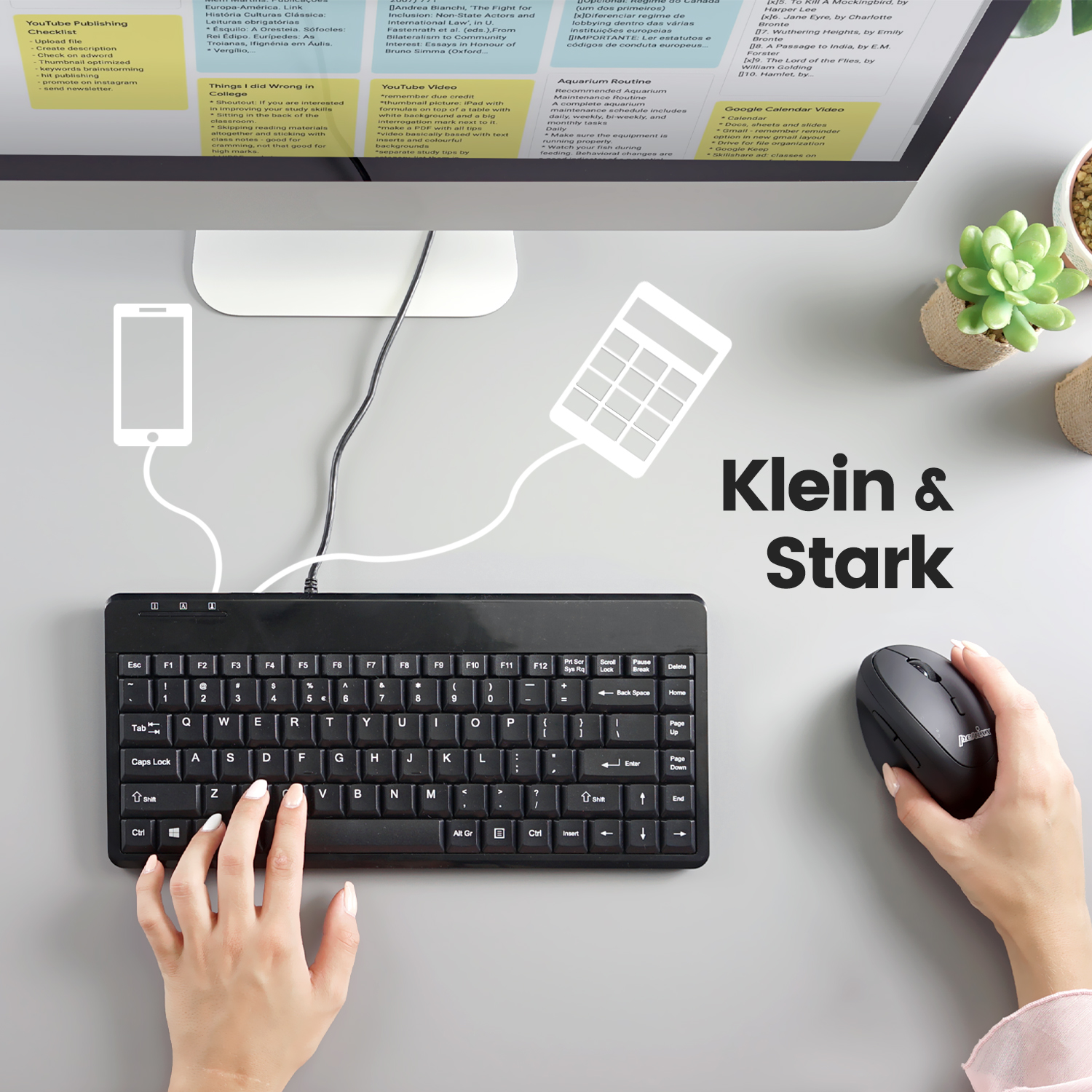Tastiera, mouse, telefono e monitor su una scrivania, con testo 'Klein & Stark'.