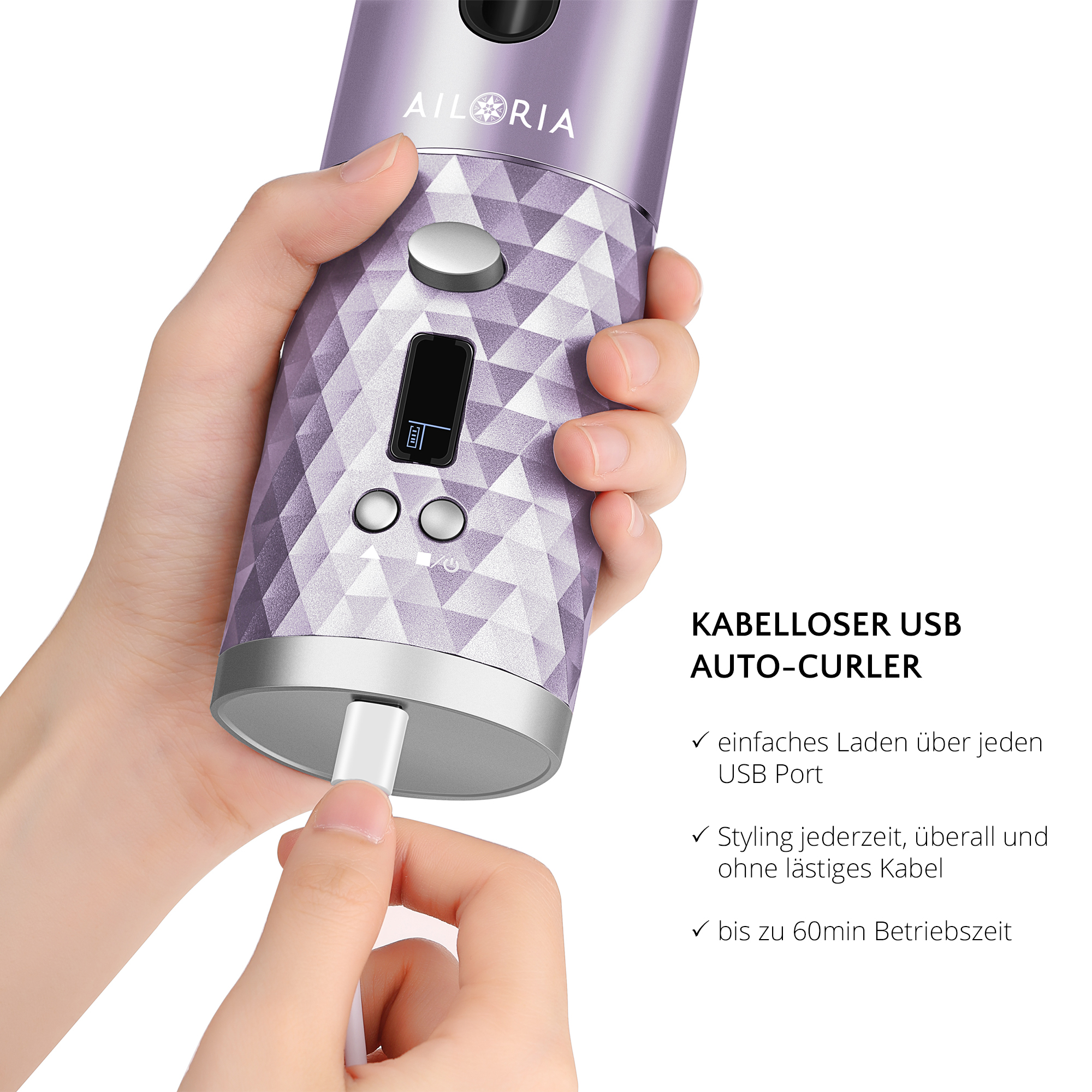 Eine Hand hält einen lila Haarlockenwickler mit USB-Ladeanschluss und kleinem Display.