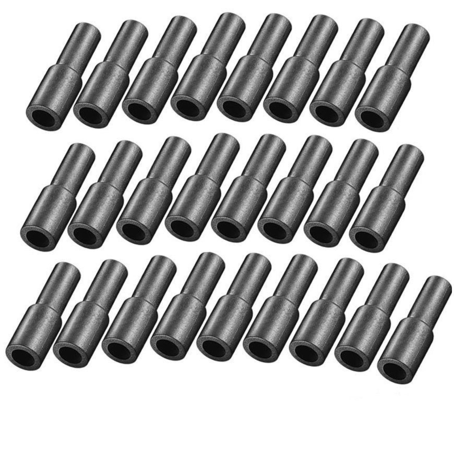 Eine Gruppe schwarzer Stecker, die in Reihen auf einer weißen Oberfläche angeordnet sind.