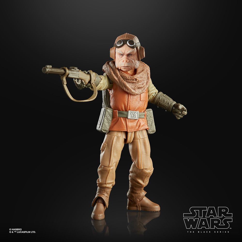 Star Wars Actionfigur, ein Nikto-Alien, in braun-orangefarbener Kleidung, hält eine Waffe.