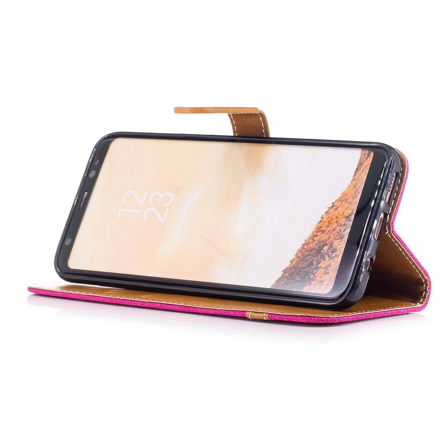 Telefon in einer rosa Handyhülle. Das Telefon zeigt die Uhrzeit an.