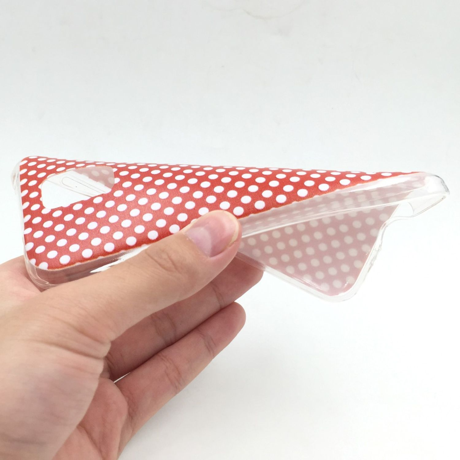 Handyhülle mit rotem Polka-Dot-Muster auf der Innenseite.