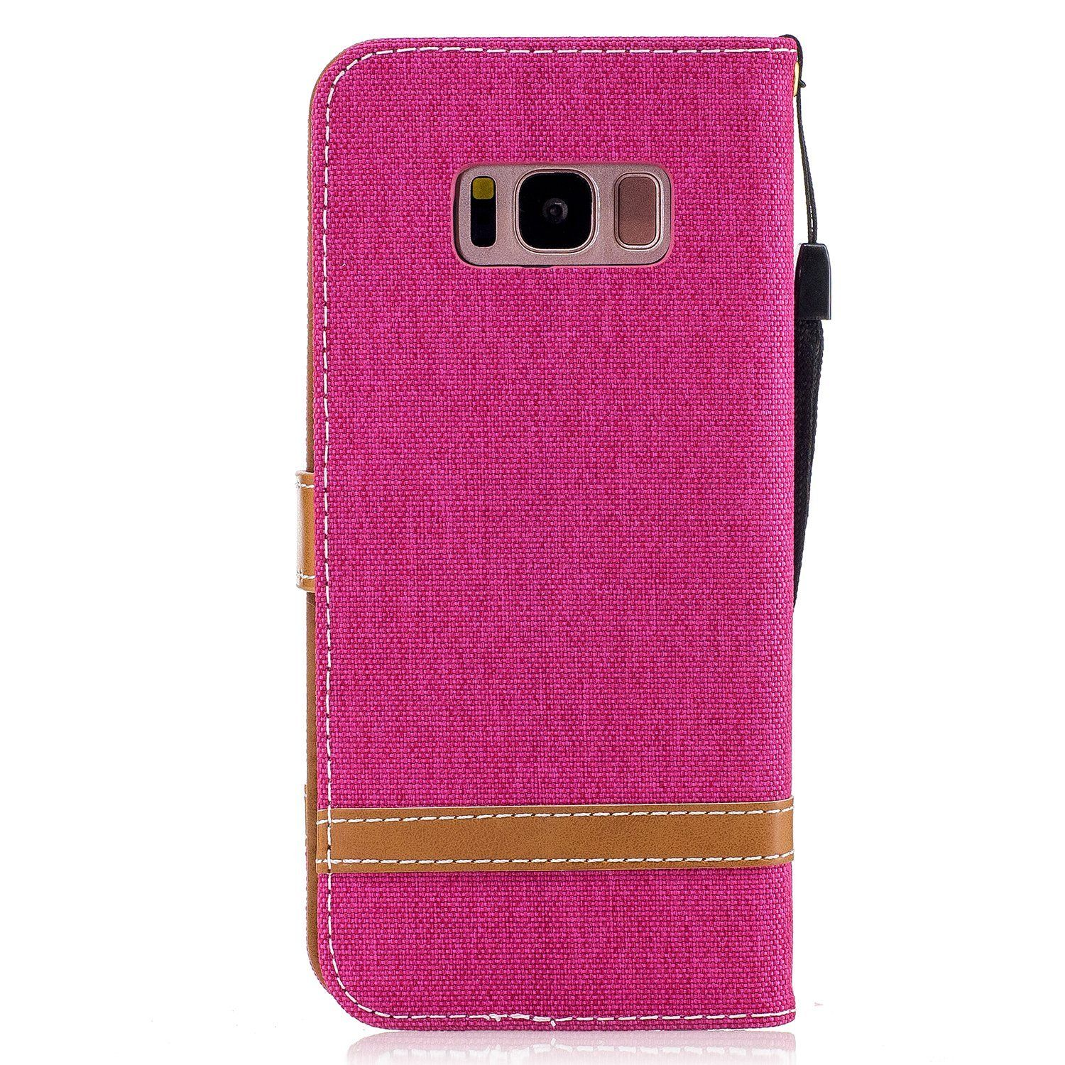 Pinke Handyhülle mit braunen Akzenten und Riemen, vor weißem Hintergrund.