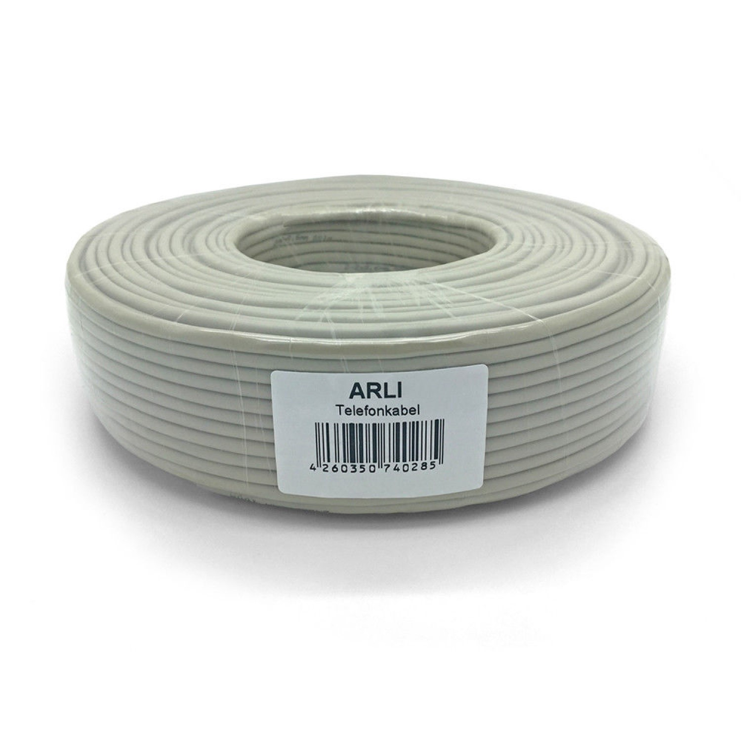 Aufgerolltes Kabel, weiß mit Etikett, auf weißem Hintergrund.