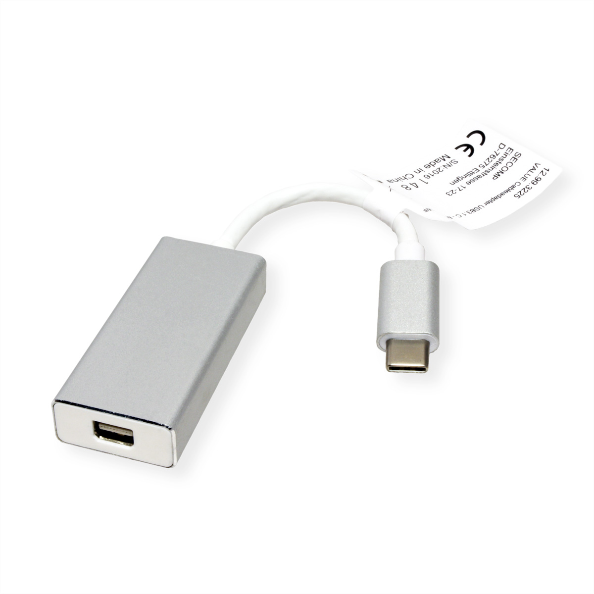 Un adaptateur USB-C vers USB, argenté, avec une étiquette attachée.