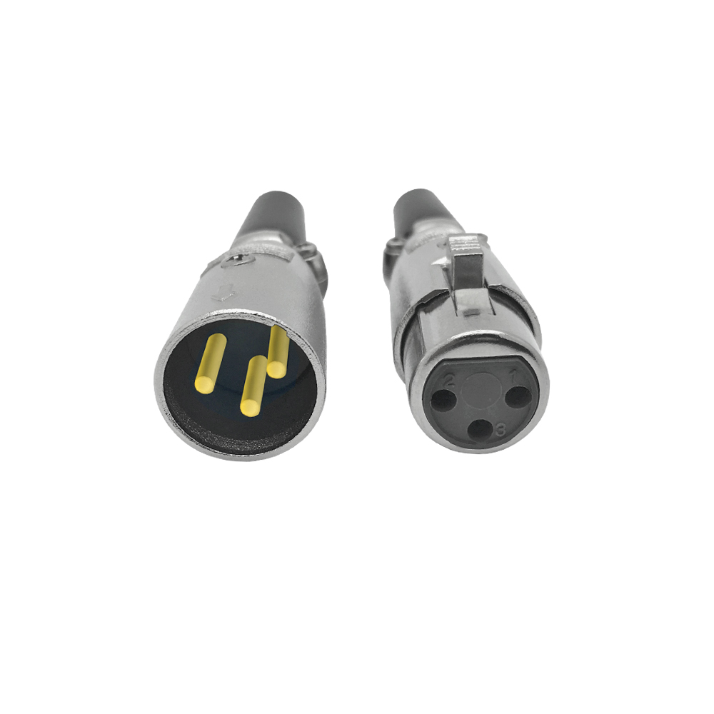 Zwei silberne XLR-Steckverbinder, die das männliche und weibliche Ende mit sichtbaren Stiften und Löchern zeigen.