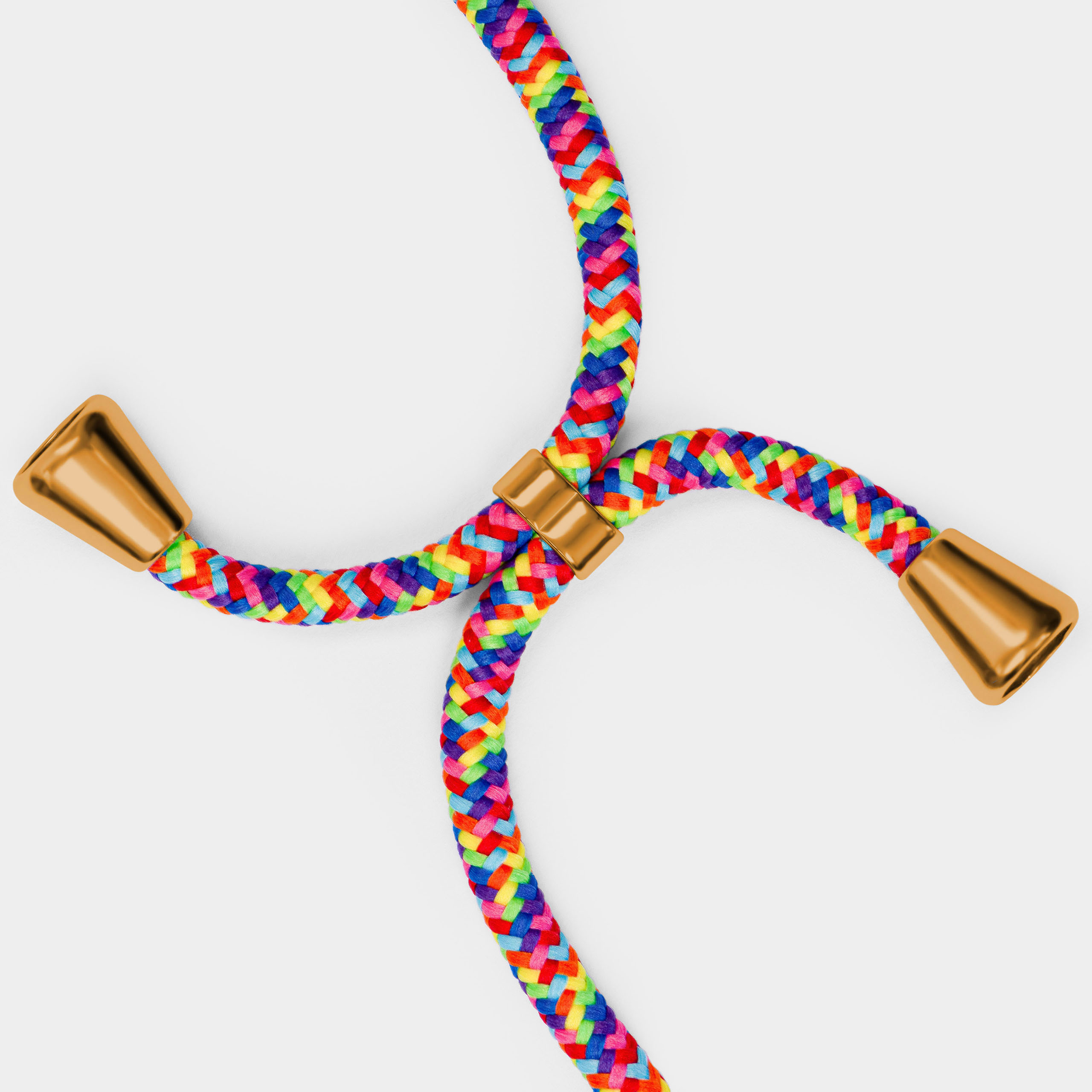 Regenbogenfarbenes geflochtenes Kabel mit goldenen Enden. Vierfachkreuzung auf weißem Hintergrund.
