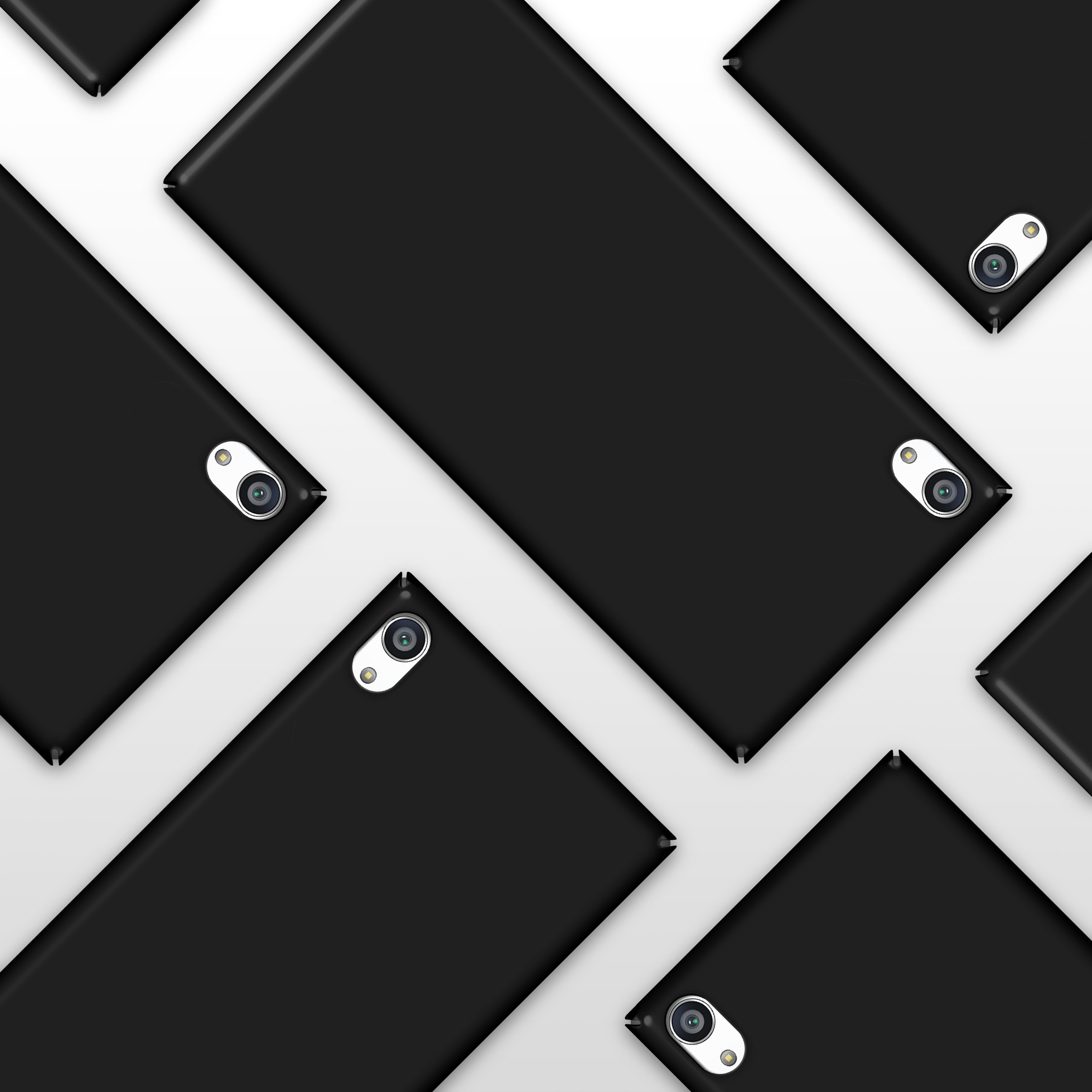 Mehrere schwarze Telefone mit Kameras. Die Telefone sind in einem Muster angeordnet.