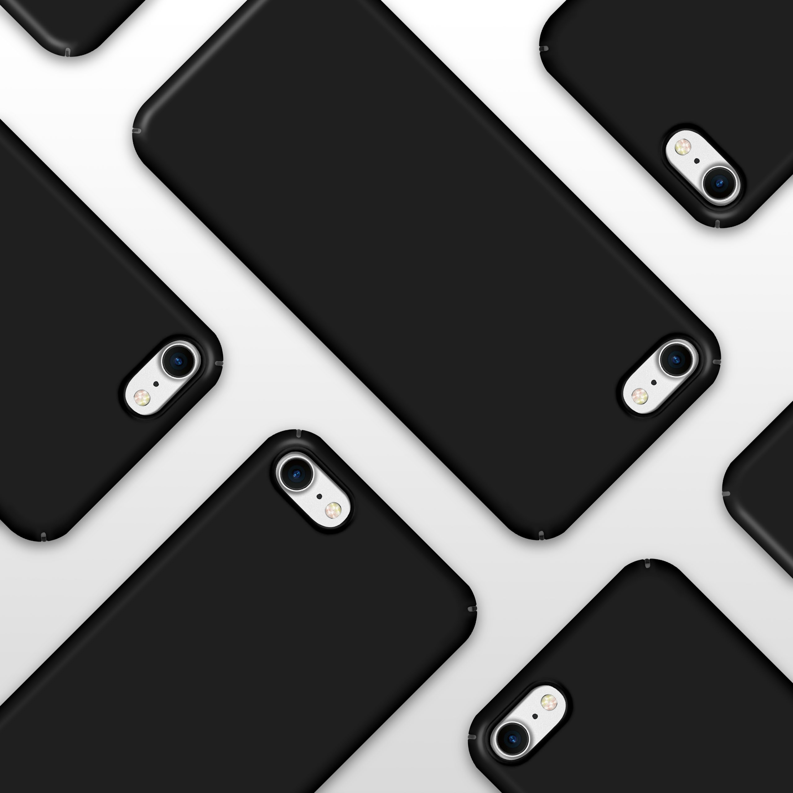 Mehrere schwarze Telefone, angewinkelt auf weißer Oberfläche, zeigen Rückkameras und Design.