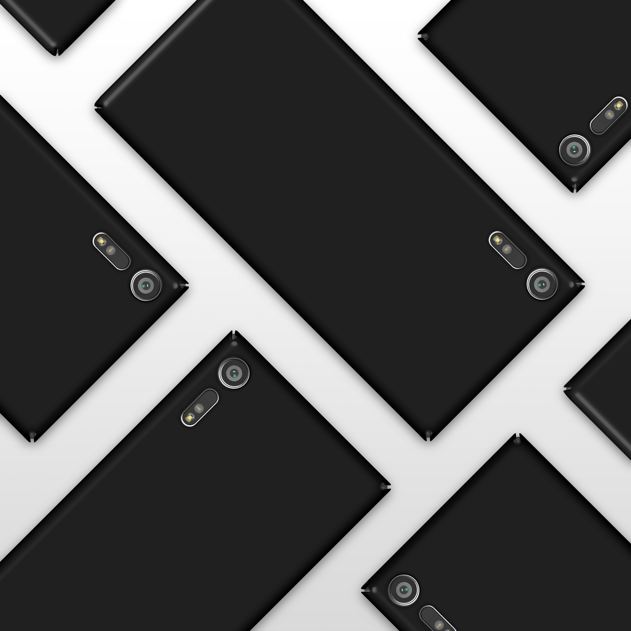 Mehrere schwarze Telefone mit Kameras auf weißem Hintergrund angeordnet.