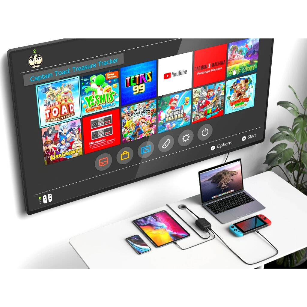 TV mit Spielen, mit Laptop, Tablet, Telefon und Switch.