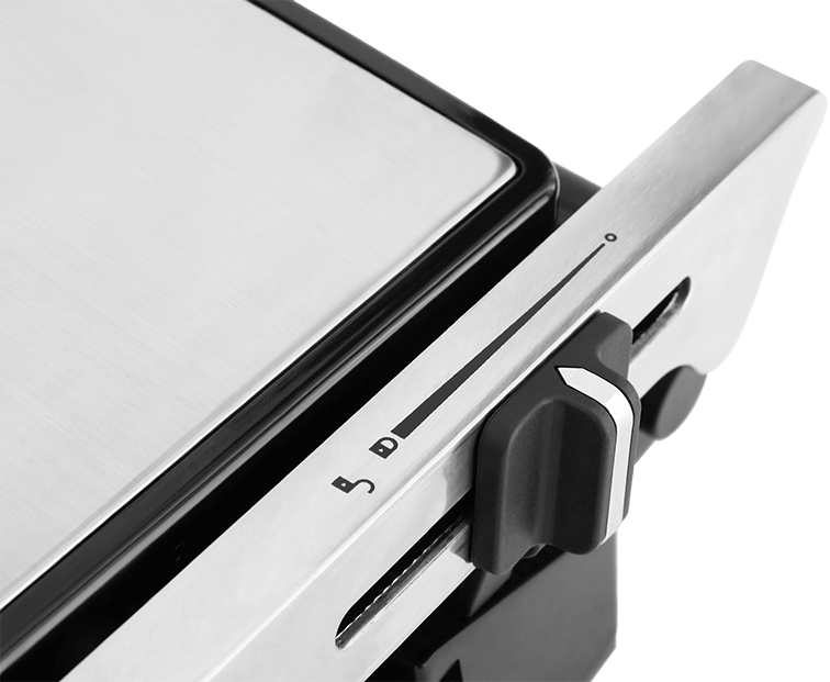 Zbliżenie srebrno-czarnego urządzenia z pokrętłem i suwakiem.