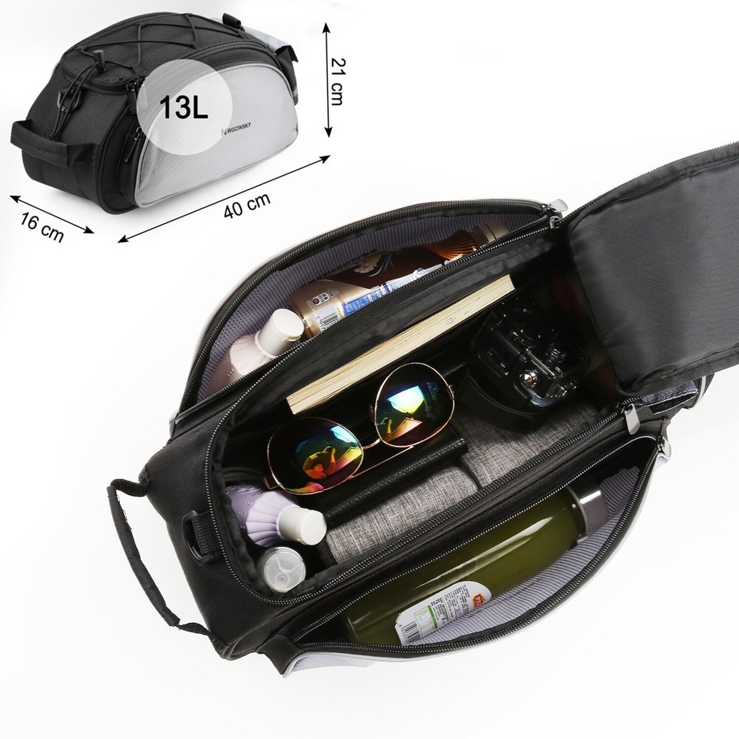 Eine schwarze und graue Motorradtasche, offen, mit Gegenständen darin. Abmessungen sind angegeben.