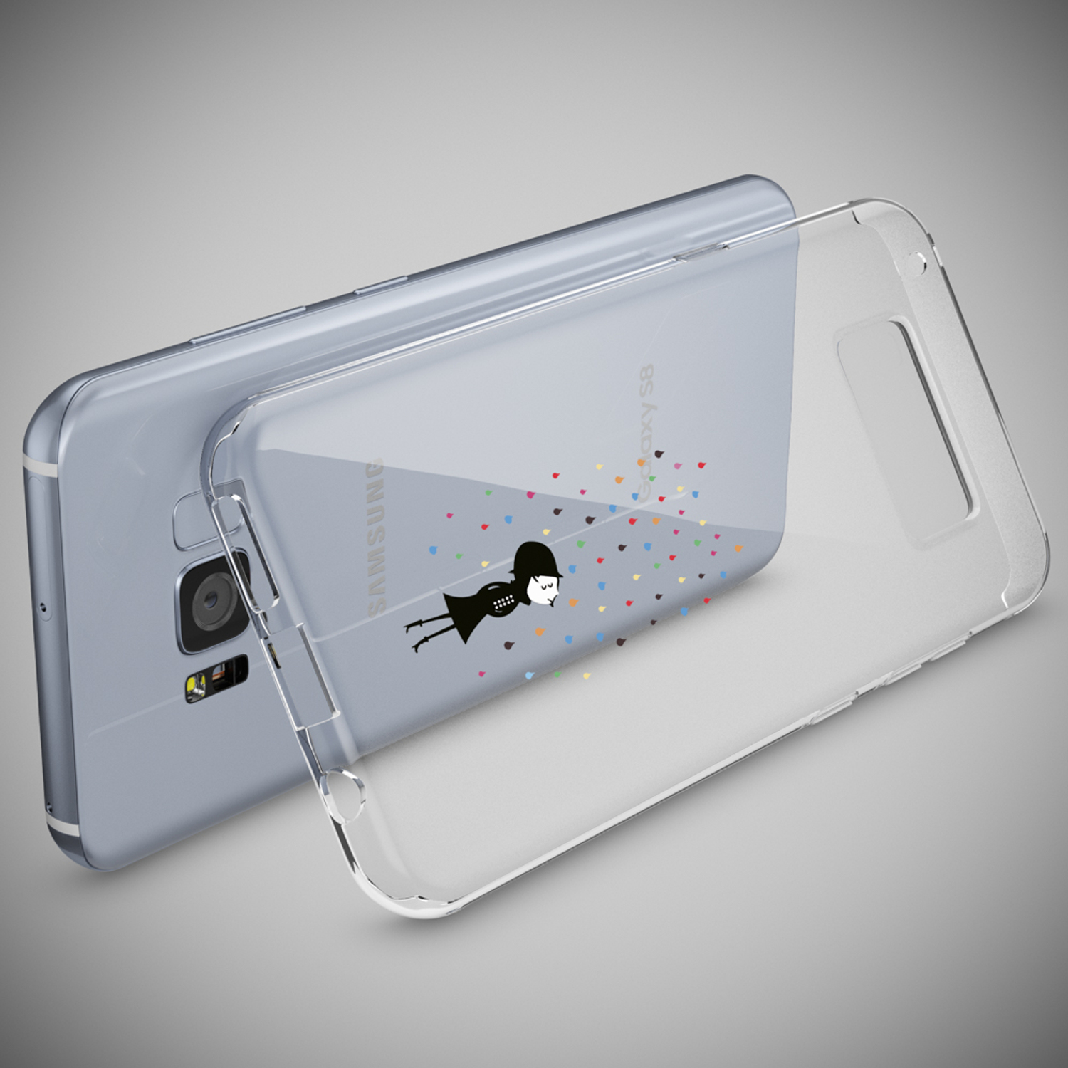 Funda de teléfono con dibujos animados. Teléfono y funda sobre una superficie gris.