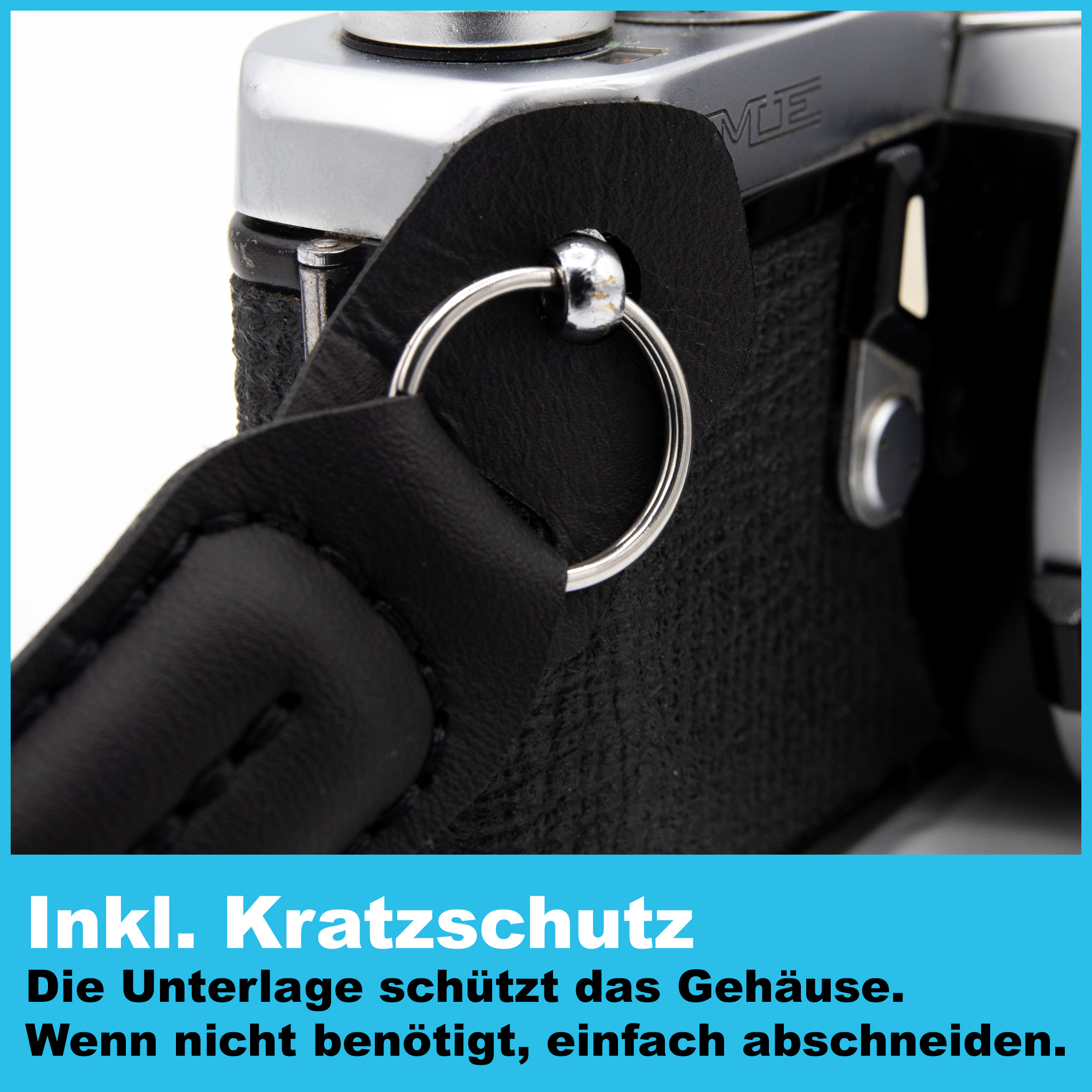 Nahaufnahme einer Kamera mit schwarzem Riemen. Text auf dem Bild: Inkl. Kratzschutz.