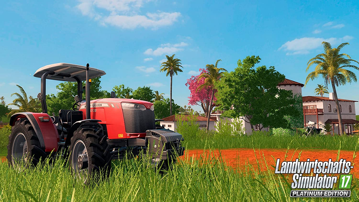 Ein roter Traktor auf einem Feld vor einem Haus. Der Himmel ist blau und das Gras ist grün.