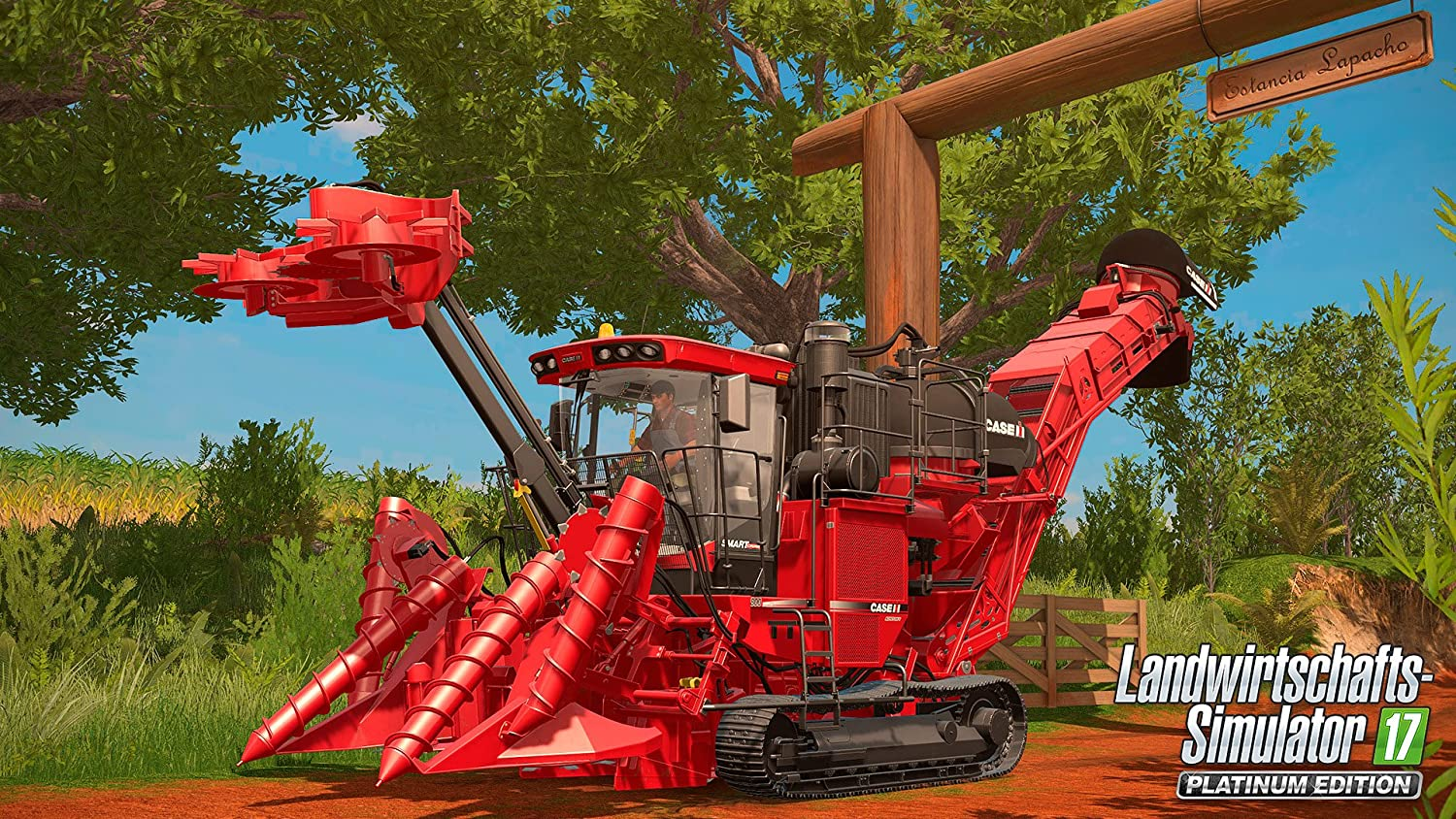 Roter Mähdrescher arbeitet auf einem Feld. Grüne Bäume, blauer Himmel. Text: Landwirtschafts-Simulator 17.