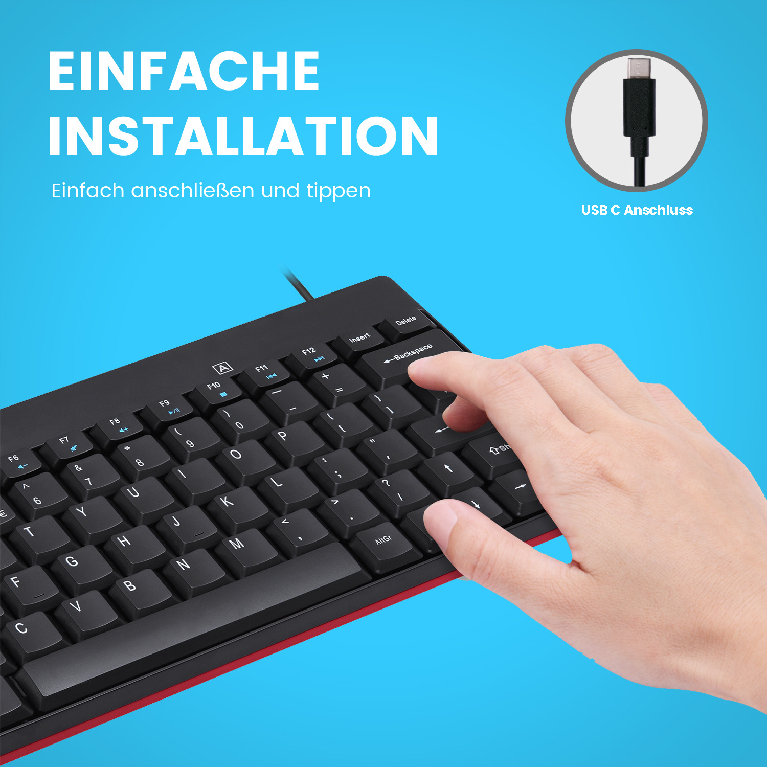 Tastatur mit schwarzen Tasten, rotem Streifen, eine Hand tippt. USB-C-Anschluss Detail.
